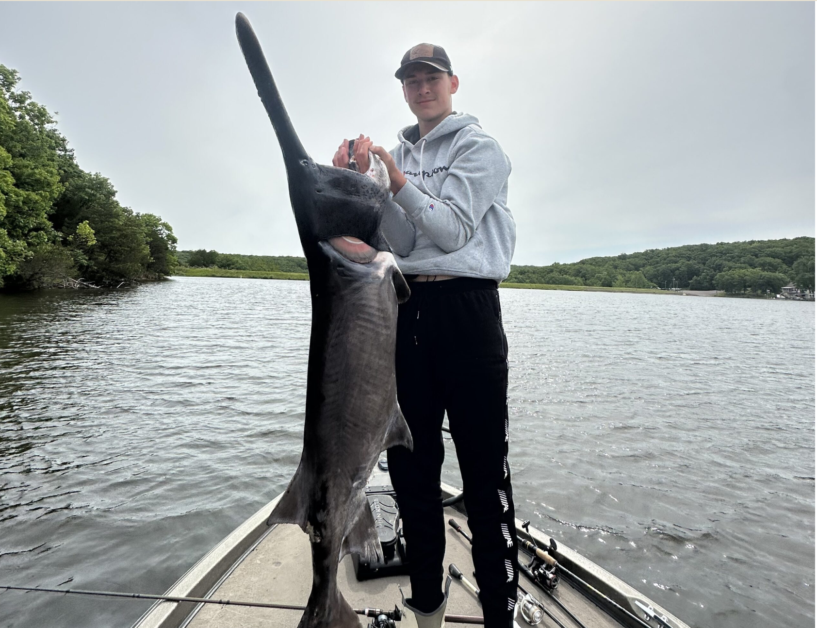 Luke Karg stands with a paddlefish he caught in Owensville (Photo submitted).