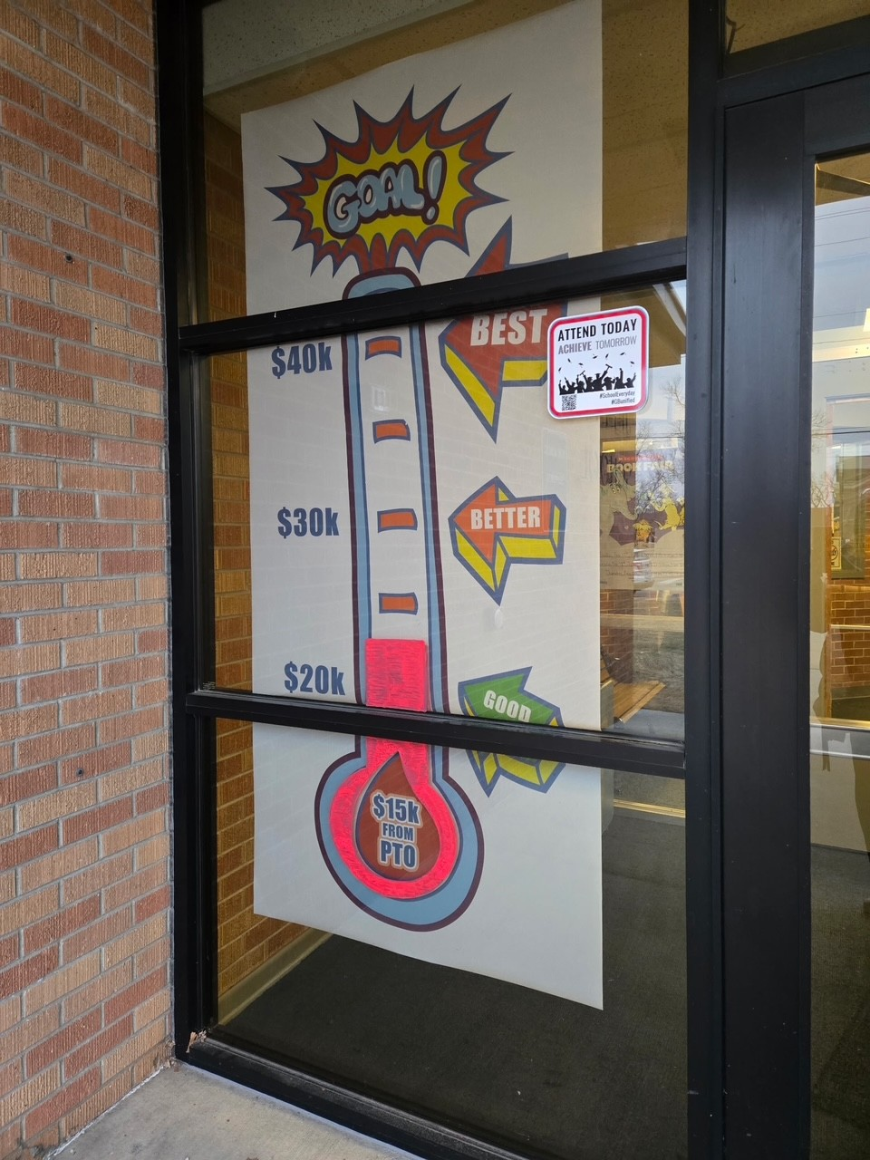 A picture outside of the front doors at Jefferson Elementary School in Great Bend shows the status of the ongoing fundraiser for new playground equipment.