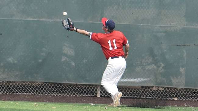 Center fielder Scotty Fegen makes a spectacular over-the-shoulder catch in deep center field to end the third inning in the No. 21 Blue Dragons' 10-5 win over Highland on Monday at Hobart-Detter Field (Sammi Carpenter/Blue Dragon Sports Information)
