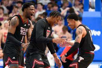 &nbsp;Texas Tech guard Chance McMillian, right celebrates with teammates, including guard Kevin Overton (1) after they defeated Kansas in an NCAA college basketball game in Lawrence, Kan., Saturday, March 1, 2025. (AP Photo/Reed Hoffmann)