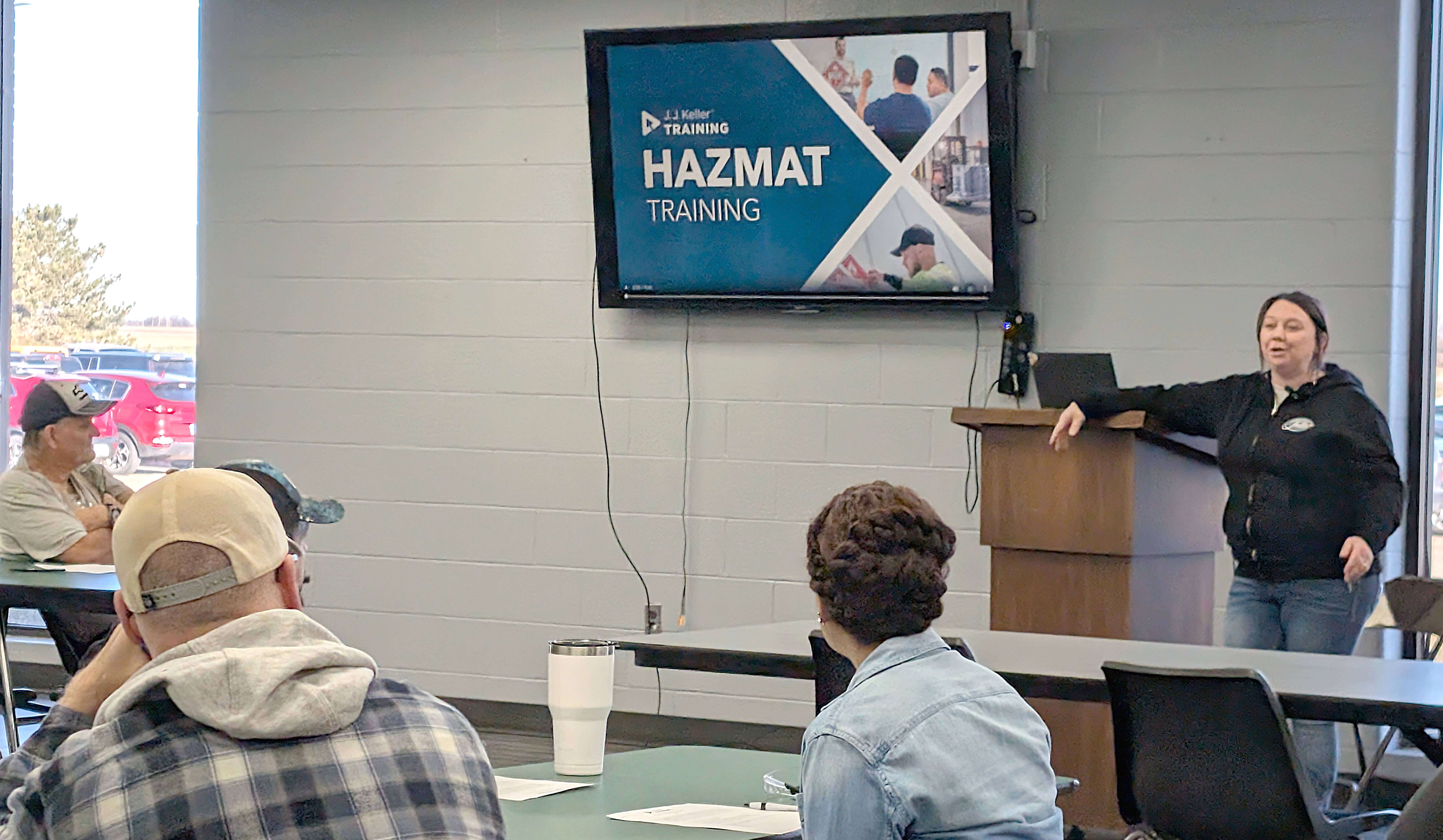Bree Husted, Fuller Industries Inc.’s environmental health and safety assistant, instructs employees on hazardous materials during one of the mandatory training sessions.