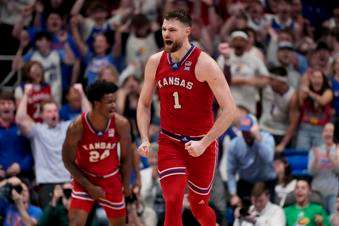 Kansas center Hunter Dickinson (1) celebrates after making a basket during the second half of an NCAA college basketball game against Arizona Saturday, March 8, 2025, in Lawrence, Kan. (AP Photo/Charlie Riedel)
