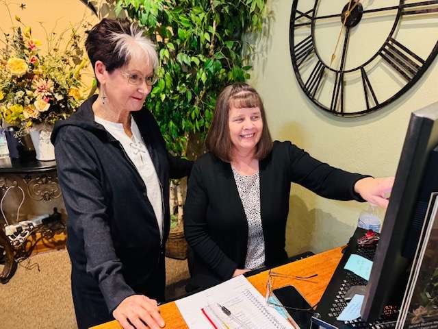 Penny Dreiling, right, reviews the schedule with Sandy Burton at Renue Salon, Spa &amp; Fashion Boutique. Dreiling is the new salon coordinator and Burton is a massage therapist at Renue.