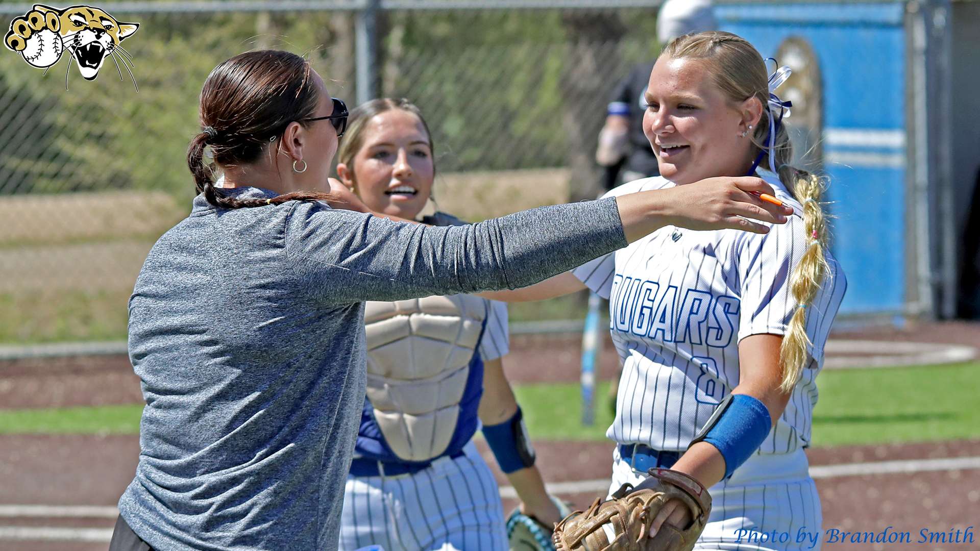 &nbsp;Meleia Ingram receives congratulations from Assistant Coach Kelcie Kippes and catcher Grace Hembree following throwing a perfect game