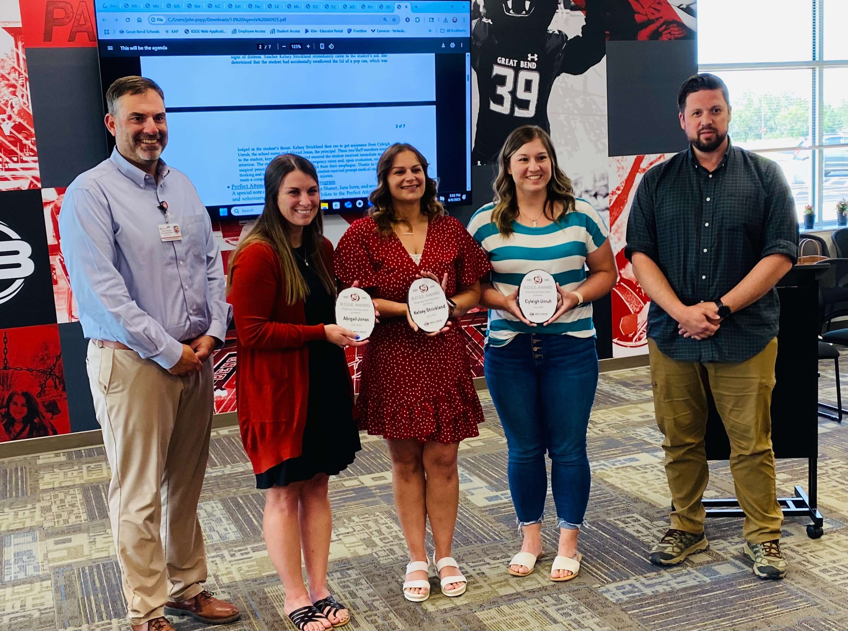Three members from Eisenhower Elementary School were presented the R.O.S.E. Award at the USD 428 Board of Education meeting on Monday, June 9, 2025 for helping a student that swallowed a pop can lid.