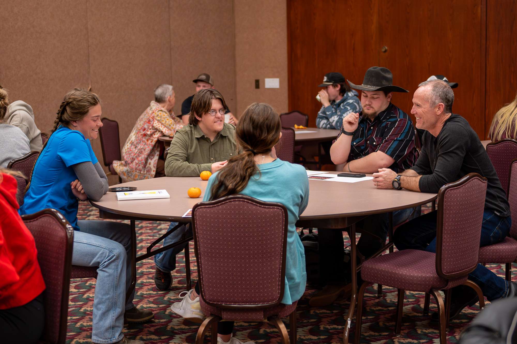 Students of Aging and Death (FCS 320), taught by Dr. Josh Ellis, right, engage in discussion at the Aging and Death Cafe in the Student Center Scottsbluff Room, April 9, 2025. (Photo by Sydney Brown/Chadron State College)