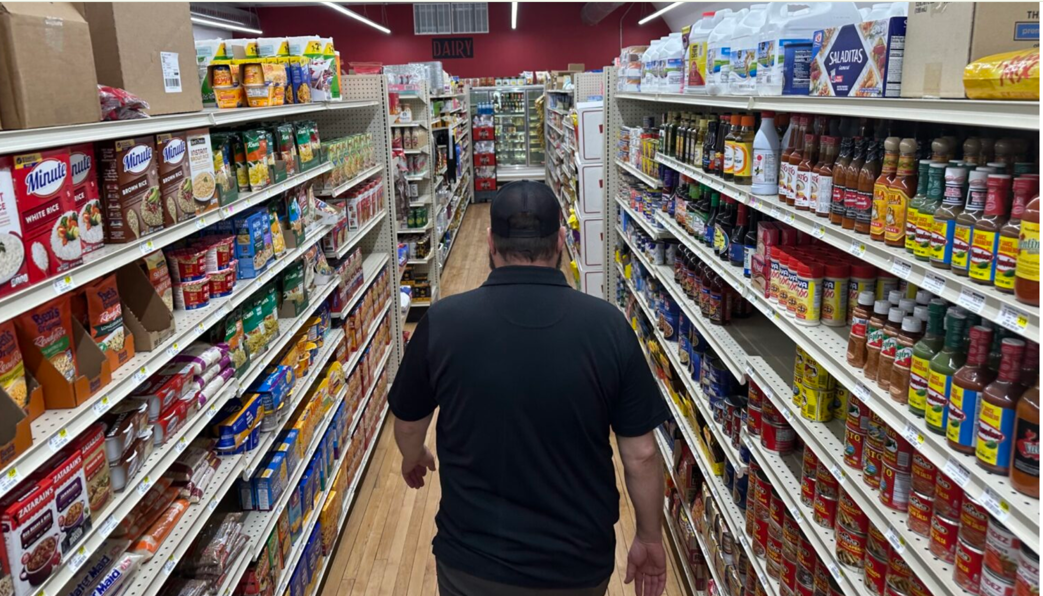  General Manager Brian Horak walks down an aisle at Post 60 Market in Emerson, Nebraska. Locals opened the market as a cooperative in 2022 after the tiny town lost its only grocery store (Kevin Hardy/Stateline).