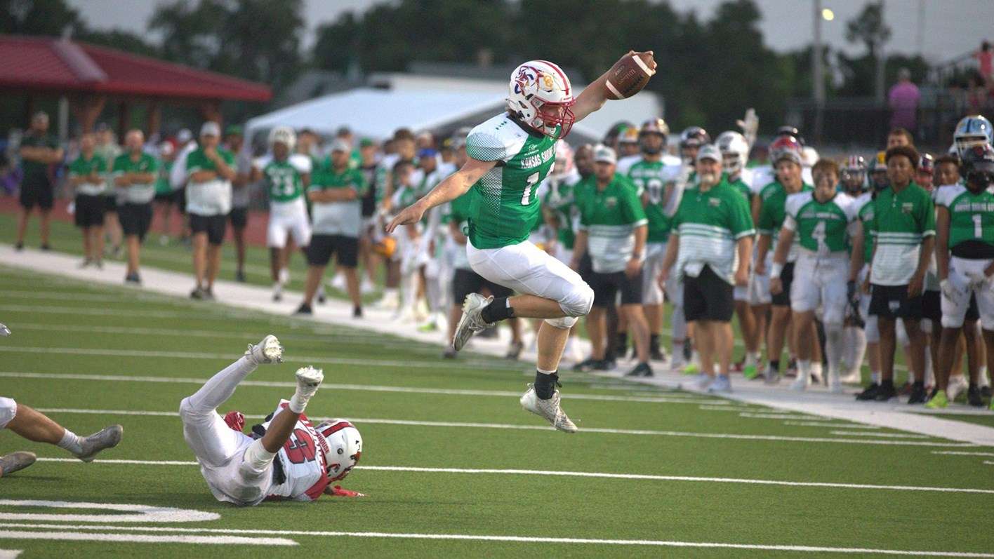 &nbsp;Cheney's Josh Burdick leaps away from a tackle - Photo - Rick Peterson Jr./Kansas Covered