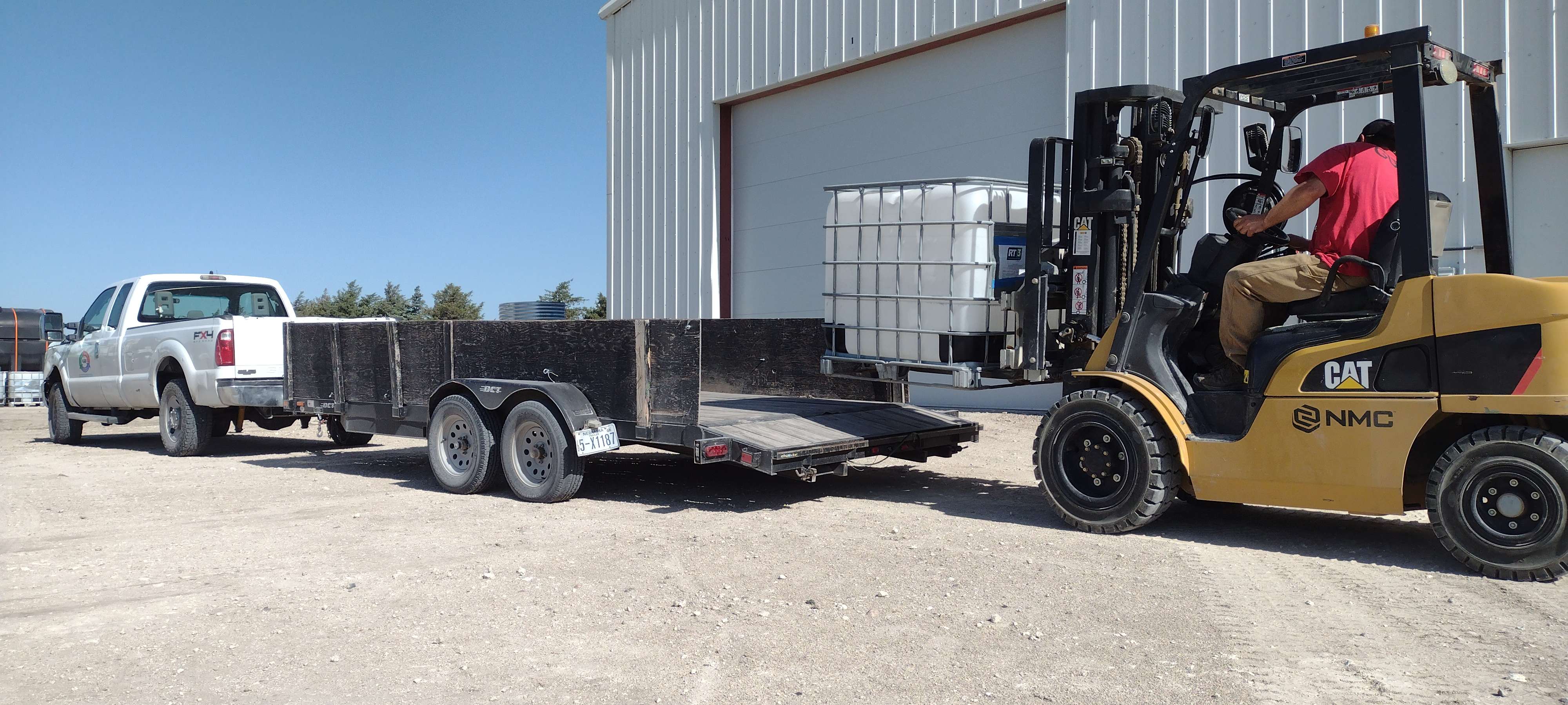 A forklift operator loads empty IBC totes at Schekall's farm to donate to Keep Alliance Beautiful this summer. KAB appreciates having totes on hand as recycling volumes continue to increase year-to-date for the second quarter of 2025.