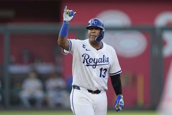 Kansas City Royals' Salvador Perez celebrates on second after hitting a one-run double during the third inning of a baseball game against the Pittsburgh Pirates, Monday, July 7, 2025, in Kansas City, Mo. (AP Photo/Charlie Riedel)