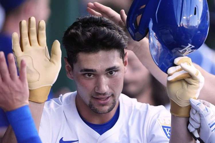 Kansas City Royals' Jac Caglianone celebrates in the dugout after hitting a solo home run during the second inning of a baseball game against the Pittsburgh Pirates, Tuesday, July 8, 2025, in Kansas City, Mo. (AP Photo/Charlie Riedel)