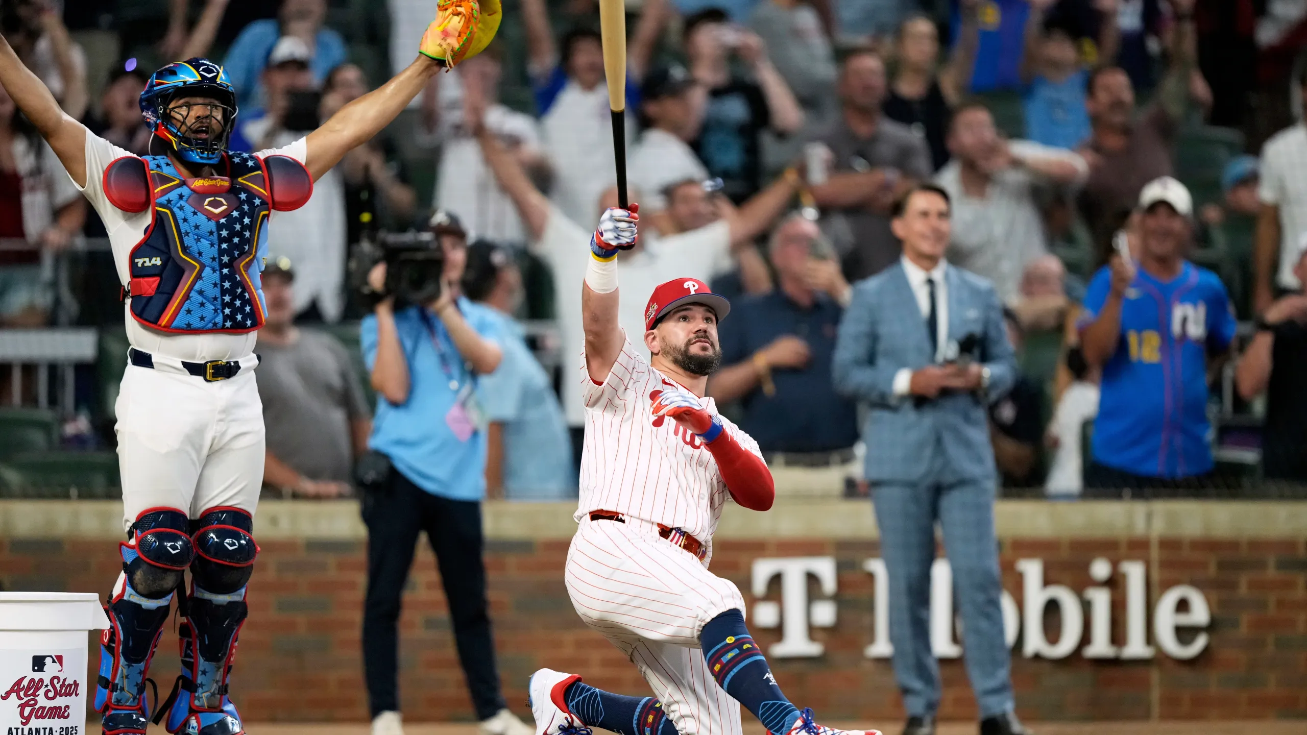 Philadelphia Phillies Kyle Schwarber celebrates after winning the tiebreaker at the MLB baseball All-Star game between the American League and National League, Tuesday, July 15, 2025, in Atlanta. (AP Photo/Brynn Anderson)