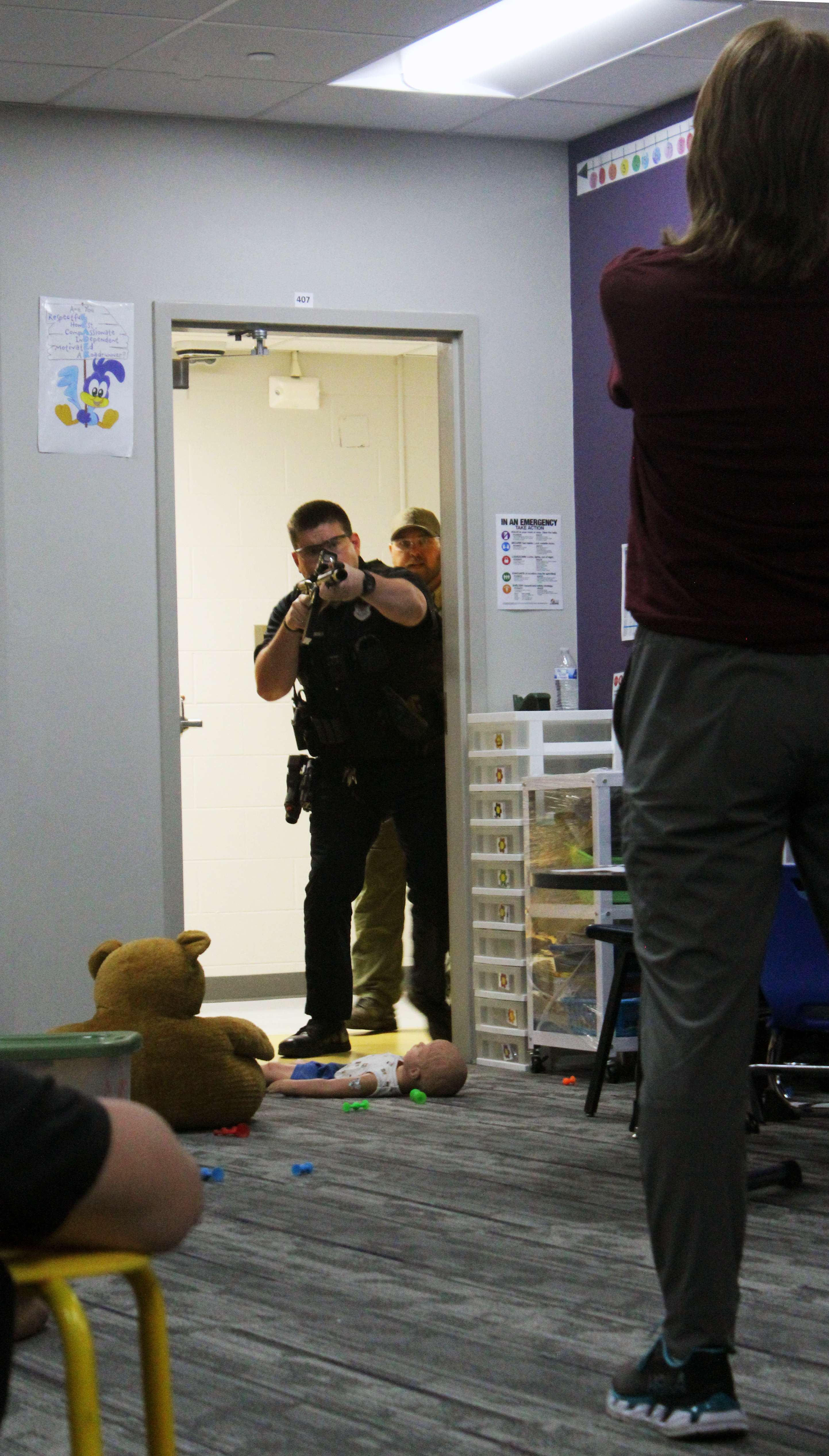 An actor portrays an active shooter as area law enforcement officers enter a classroom Wednesday at Roosevelt Elementary School. Photo by Cristina Janney/Hays Post