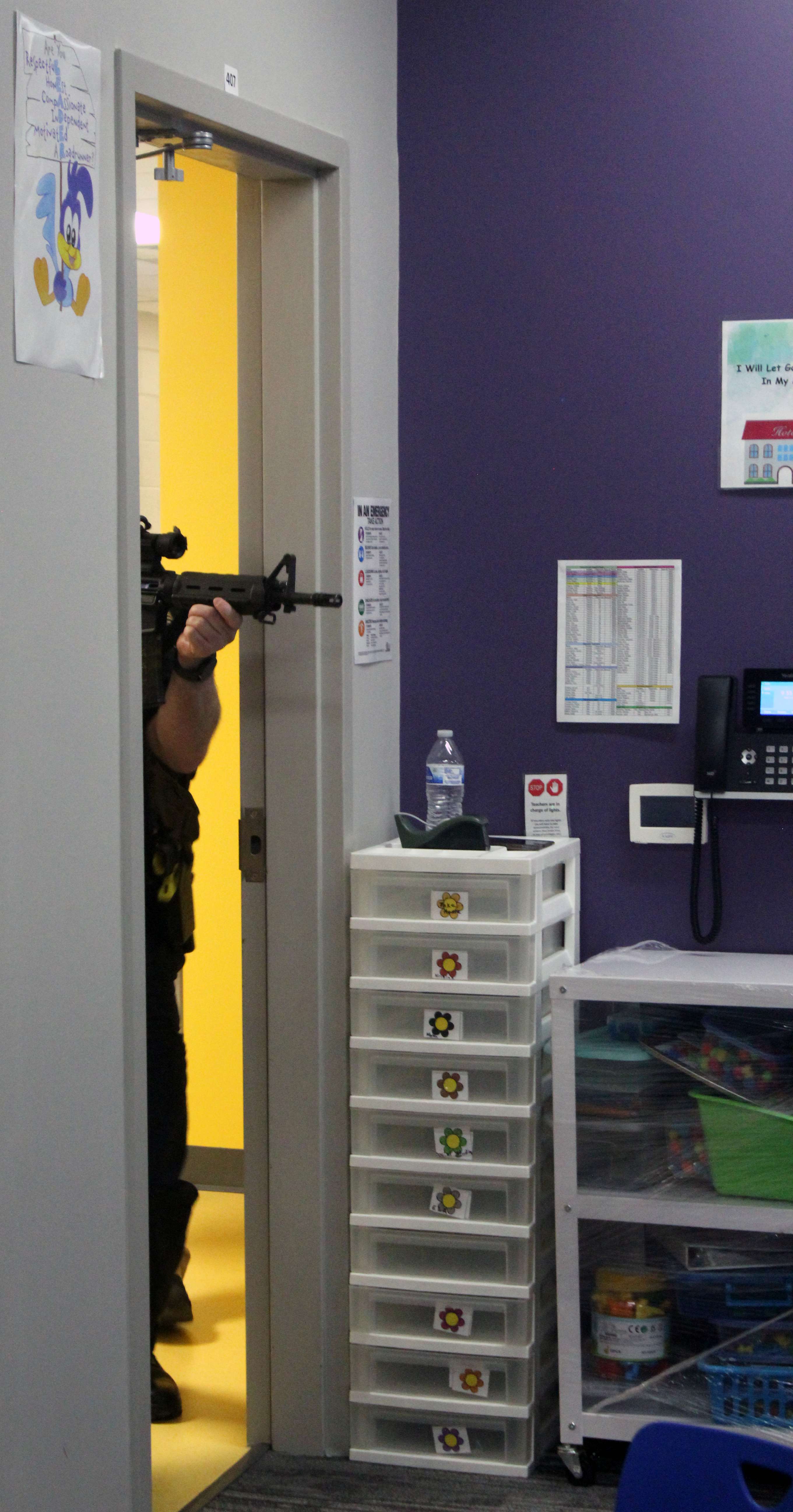 Officers begin to breach a classroom during active shooter training on Wednesday. Photo by Cristina Janney/Hays Post