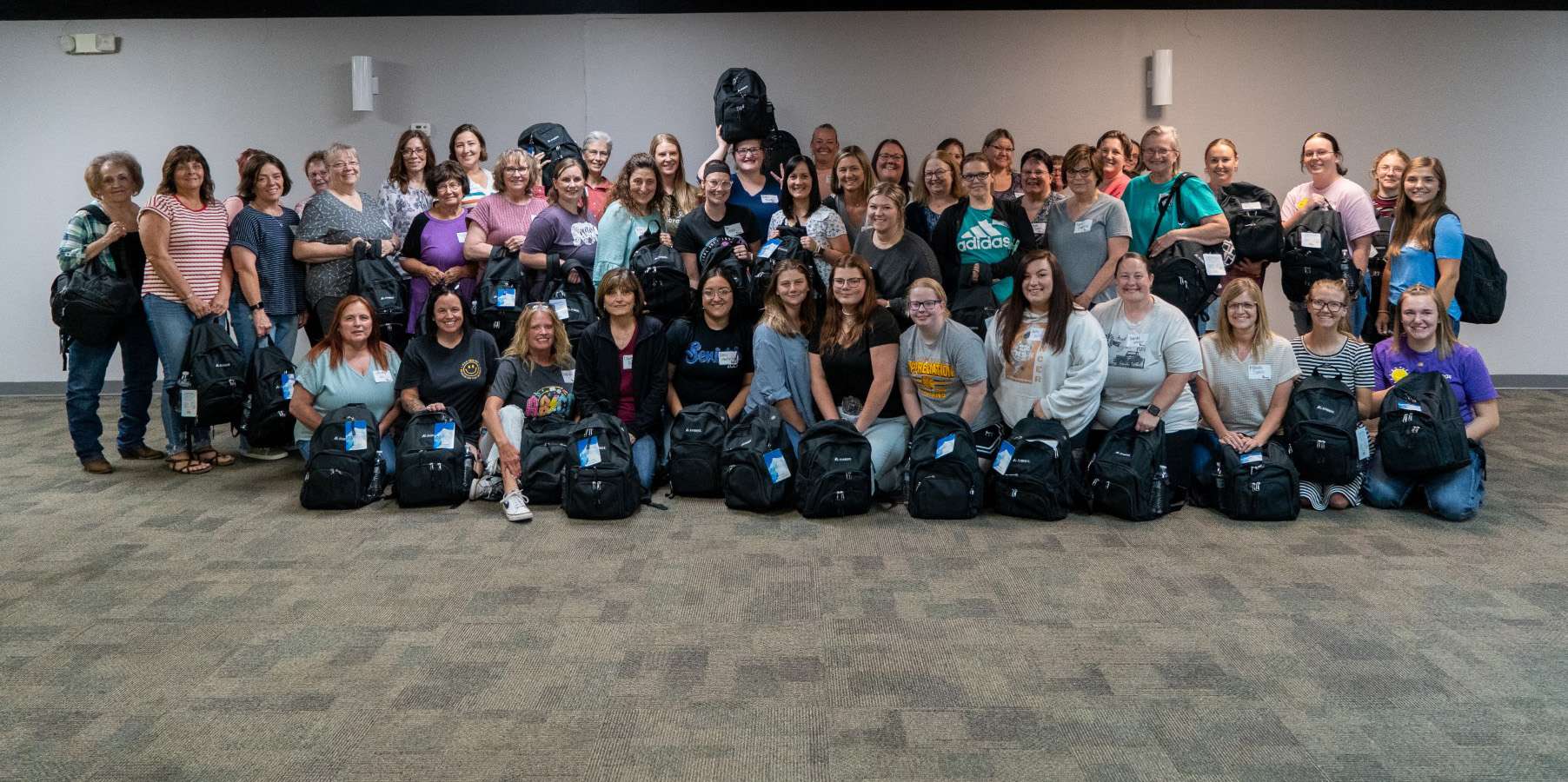 Local child care providers with crisis bags. Photo by The Chamber in Hays