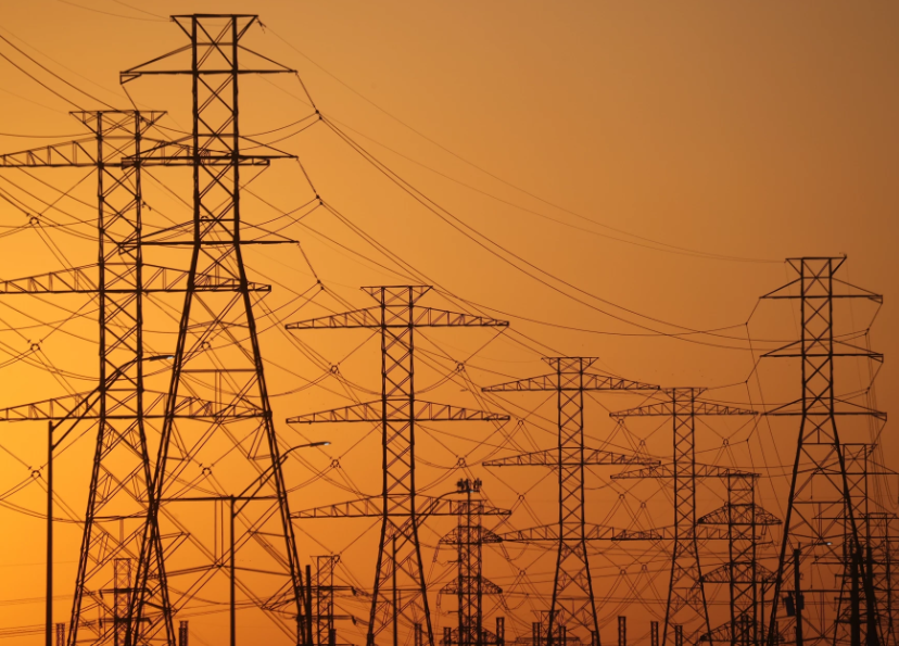 A view of high-voltage transmission towers in Houston. The law President Trump signed on July 4 ends tax incentives for wind and solar projects and is expected to drive up electricity bills across the U.S., according to a nonpartisan think tank. Photo by Justin Sullivan/Getty Images