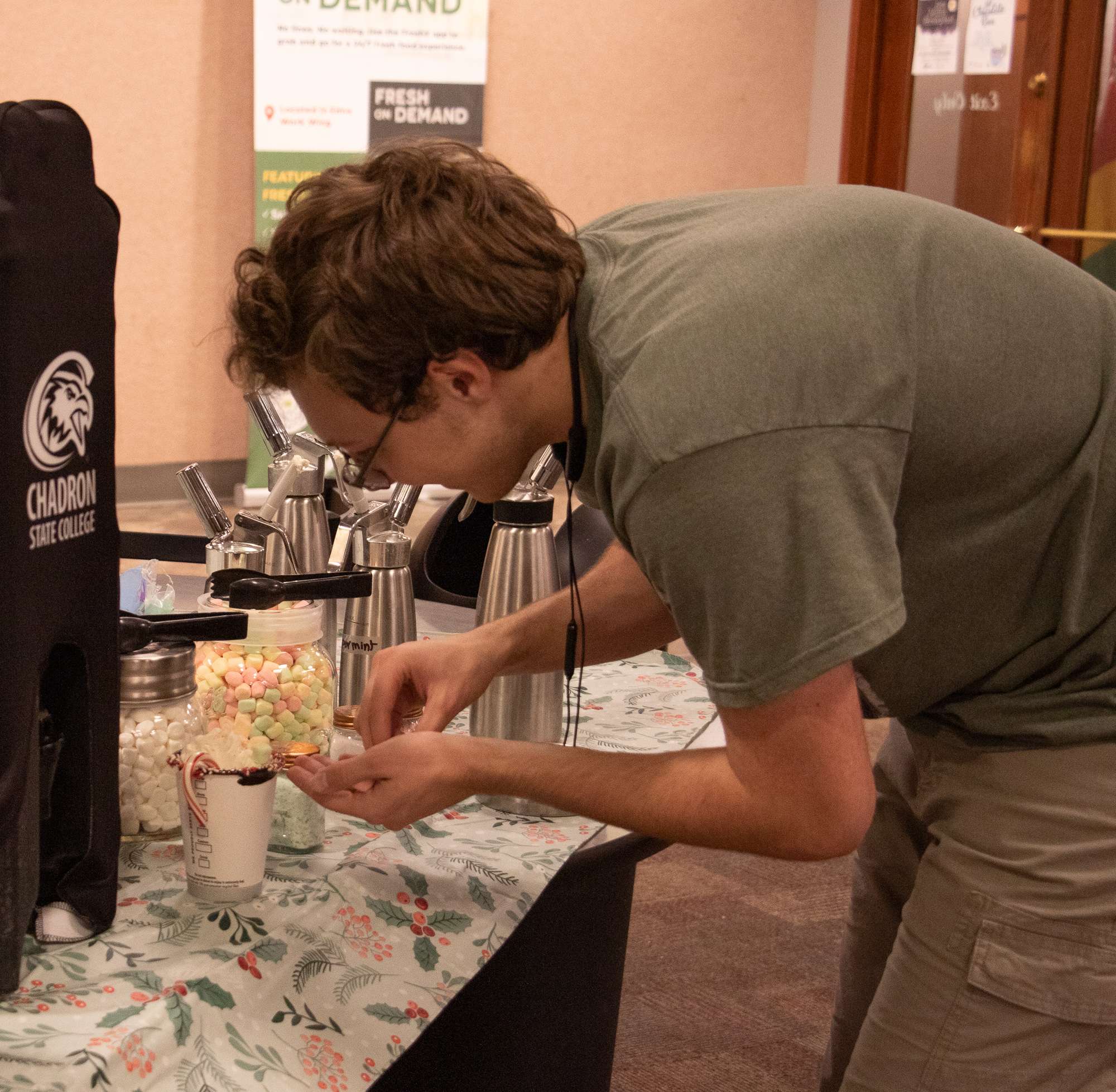 Sebastian Garcia of Rapid City, S.D., creates a custom hot chocolate during the Late Night Breakfast Dec. 9, 2024. (Photo by Tena L. Cook/Chadron State College)