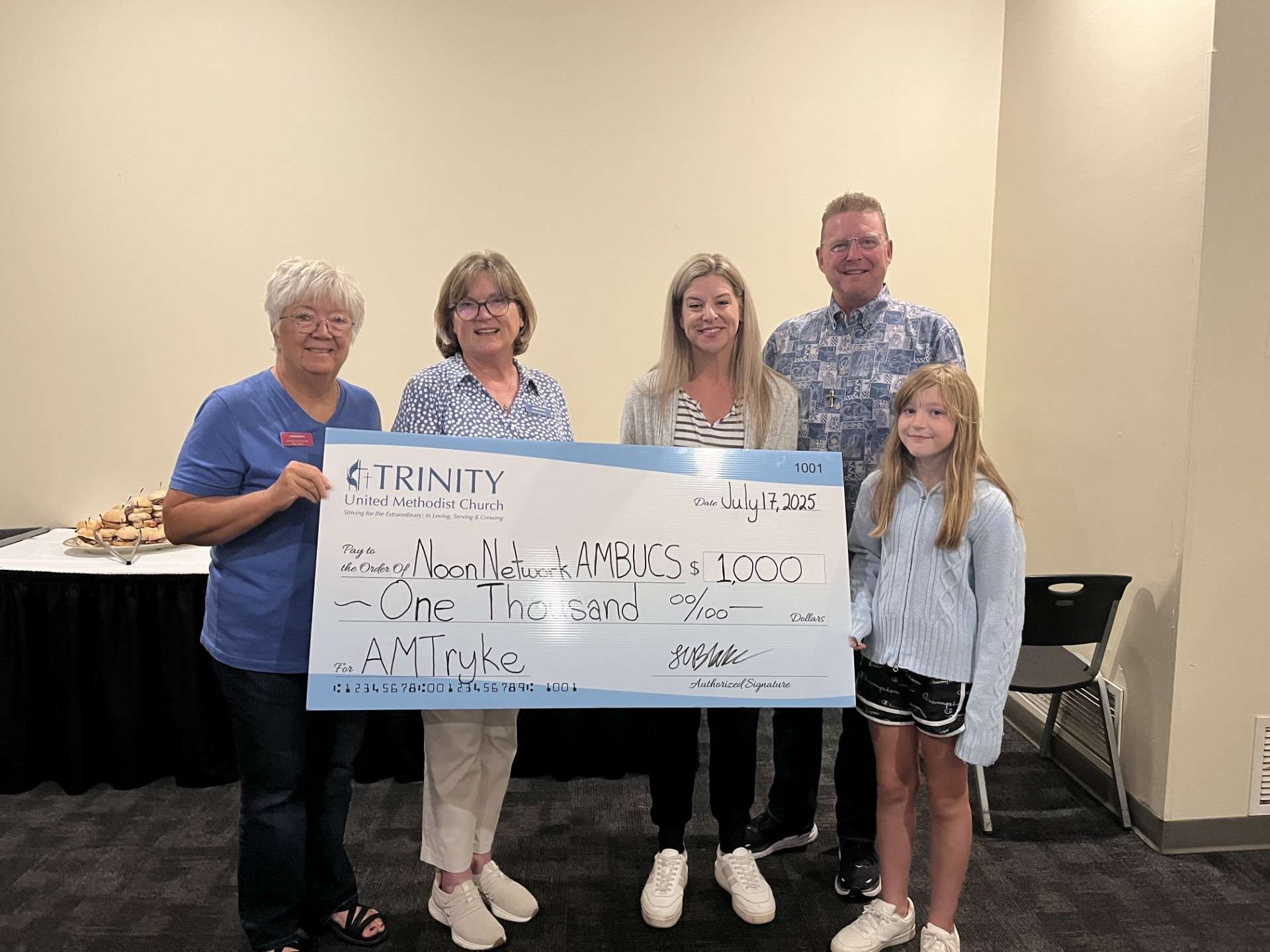 Trinity United Methodist Church gives donation of $1,000 to Salina's Noon Network AMBUCS AmTryke Program; photo courtesy of Noon Network AMBUCS (Salina, KS)