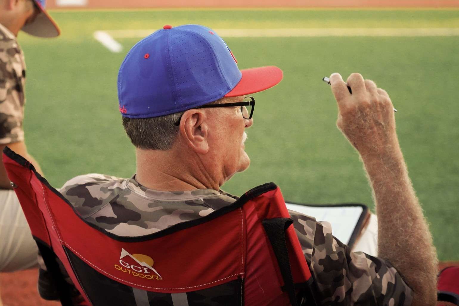 Keith Harper charts pitches for the Larks from the comfort of his portable rocking chair. Courtesy photo 