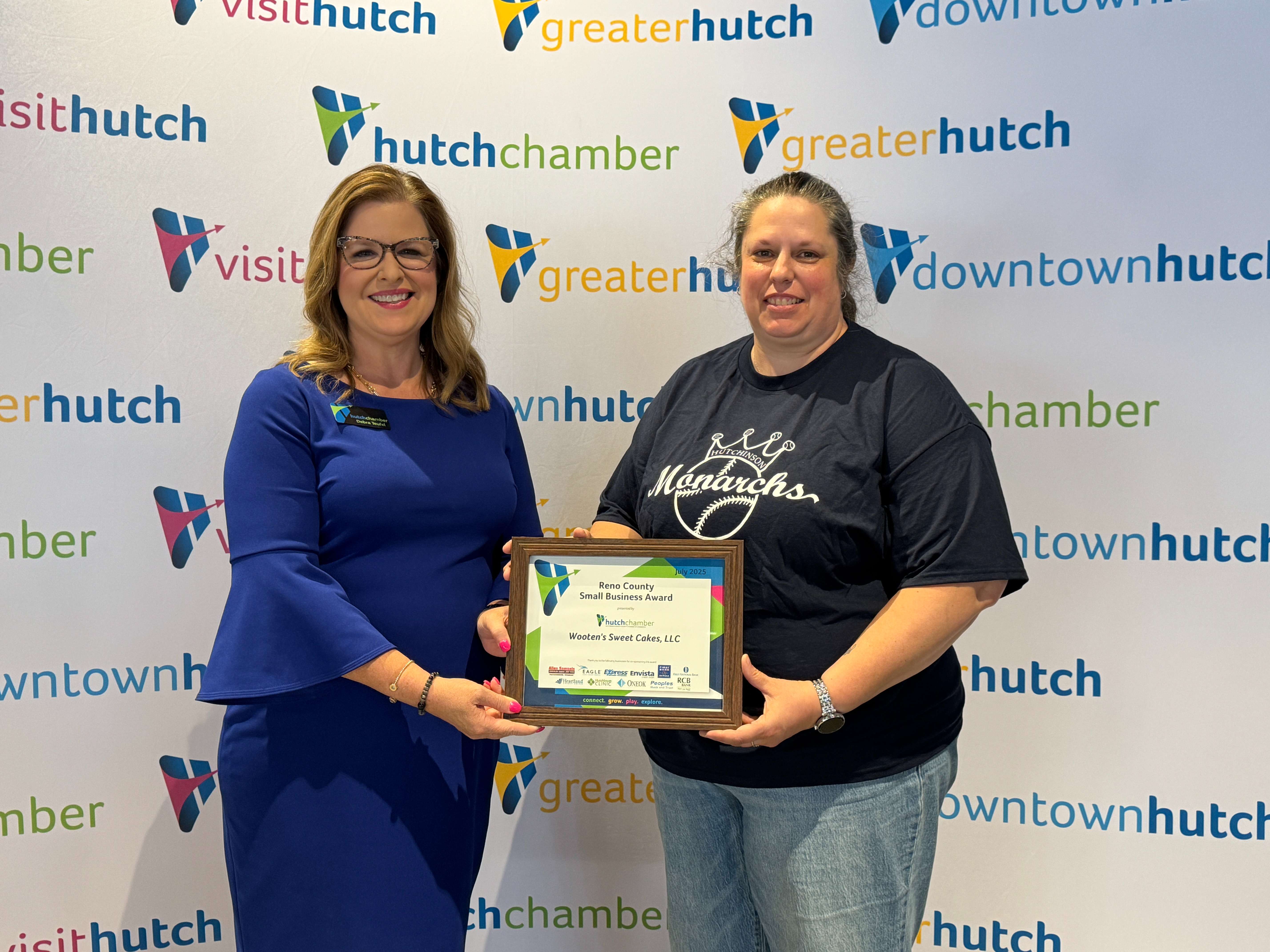 Hutchinson/Reno County Chamber of Commerce July Small Business of the Month is Wooten's Sweet Cakes - Pictured L to R, Debra Teufel CEO of the Hutchinson / Reno County Chamber of Commerce and Roseann Wooten of Wooten's Sweet Cakes (Photo courtesy of the Hutchinson/Reno County Chamber of Commerce)