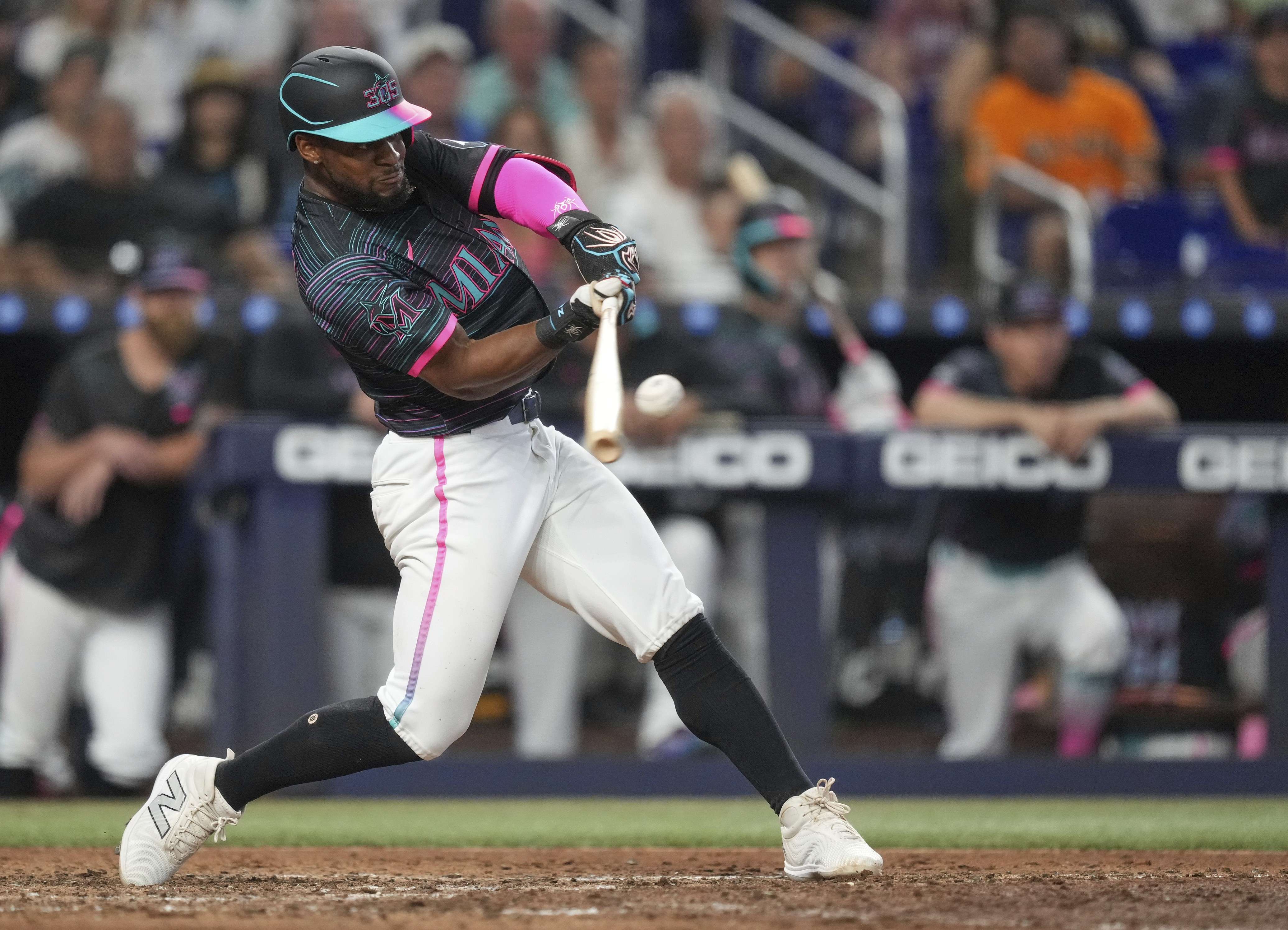 Miami Marlins' Otto Lopez hits a double to bring in two runs in the eighth inning of a baseball game against the Kansas City Royals, Saturday, July 19, 2025, in Miami. (AP Photo/Rebecca Blackwell)
