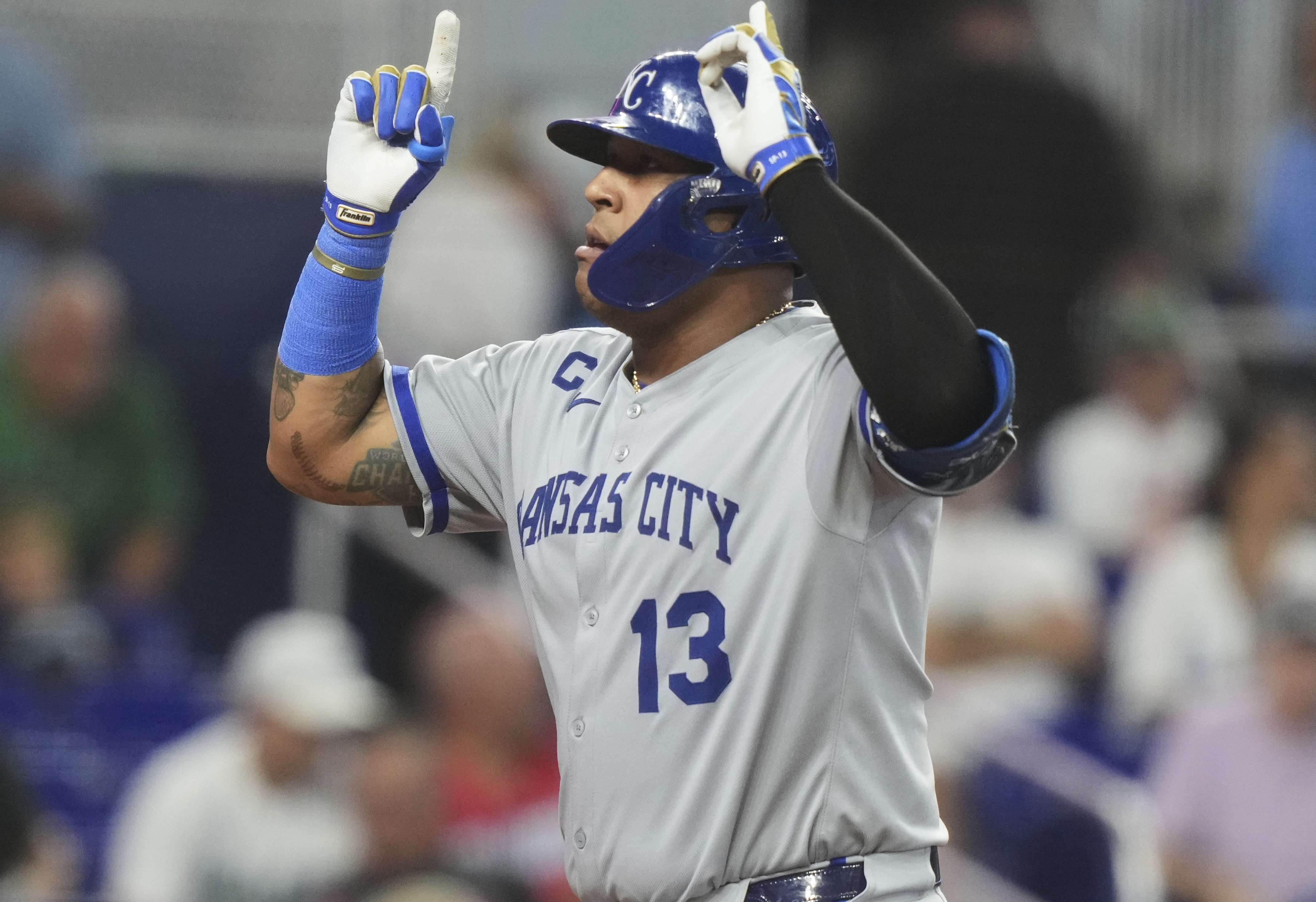 Kansas City Royals' Salvador Perez (13) gestures as he scores after hitting a solo home run during the eighth inning of a baseball game against the Miami Marlins, Sunday, July 20, 2025, in Miami. (AP Photo/Lynne Sladky)