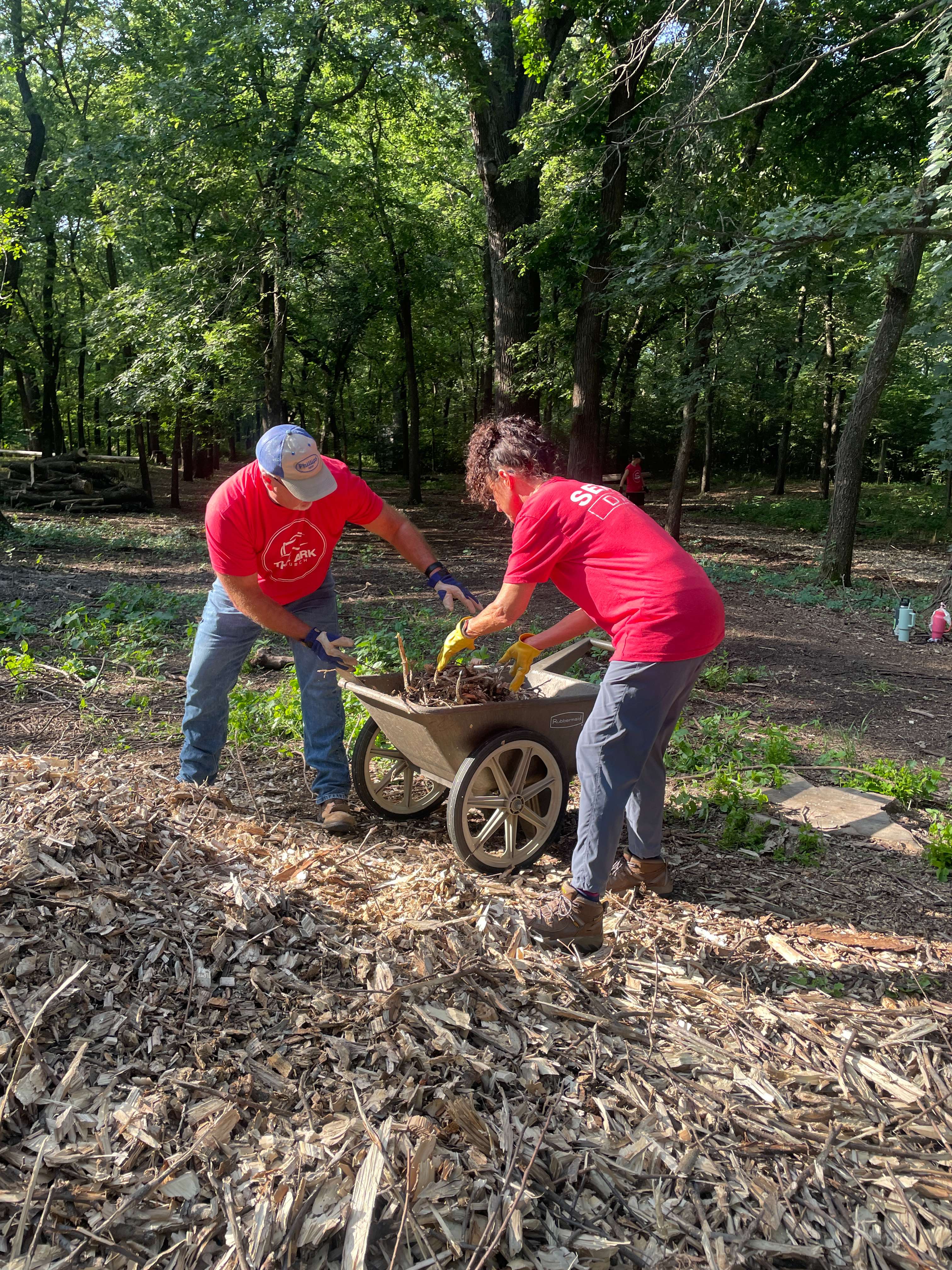 Two people working during The Ark Church "Serve Day" on Saturday, July 19; photo courtesy of Ark Church Pastor, John Huseman