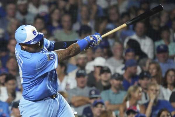 Kansas City Royals' Salvador Perez hits a two-run home run during the eighth inning of a baseball game against the Chicago Cubs in Chicago, Monday, July 21, 2025. (AP Photo/Nam Y. Huh
