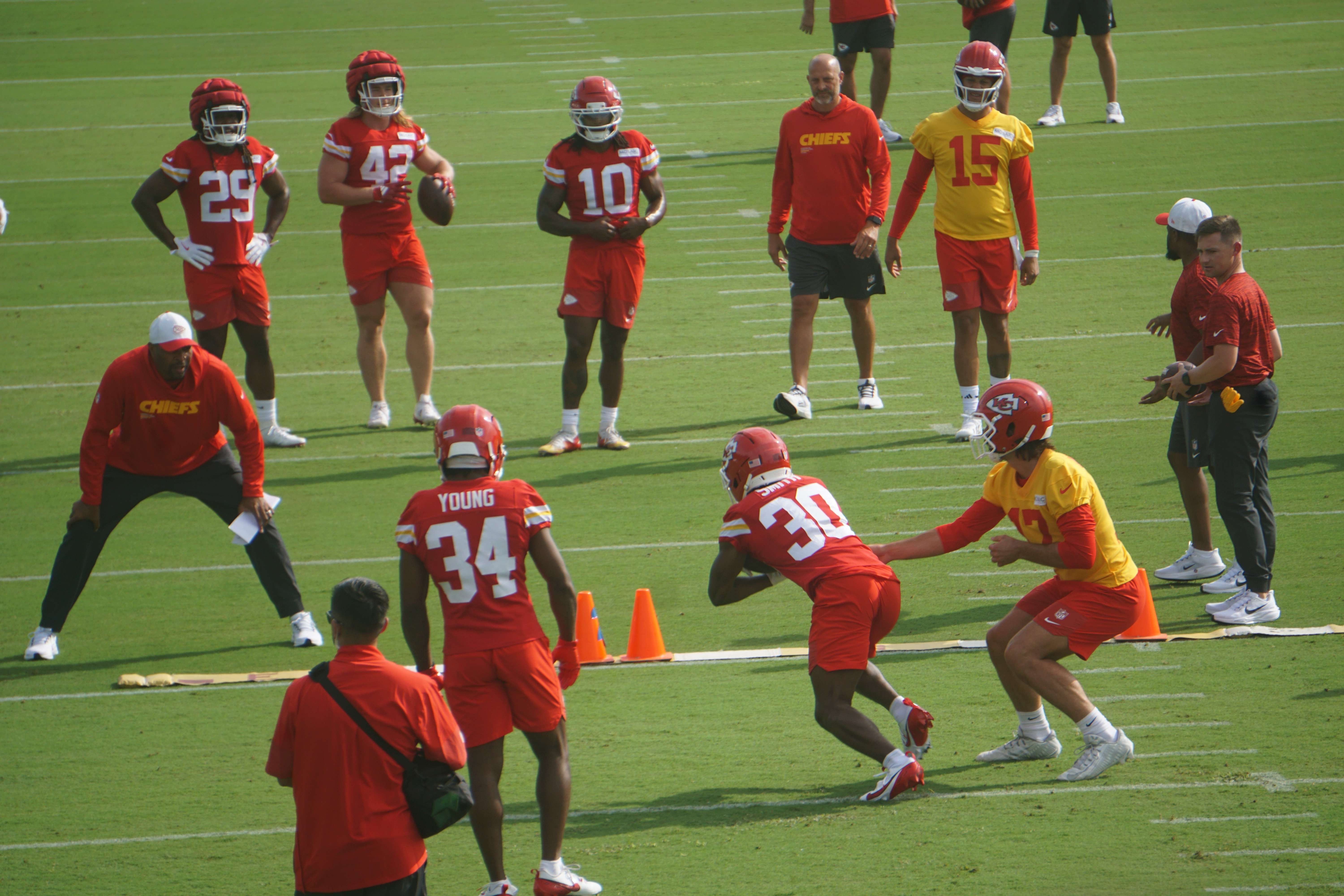 Gardner Minshew (17) hands the ball off to Brashard Smith (30) as Patrick Mahomes and offensive coordinator Matt Nagy watch on/ Photo by Matt Pike