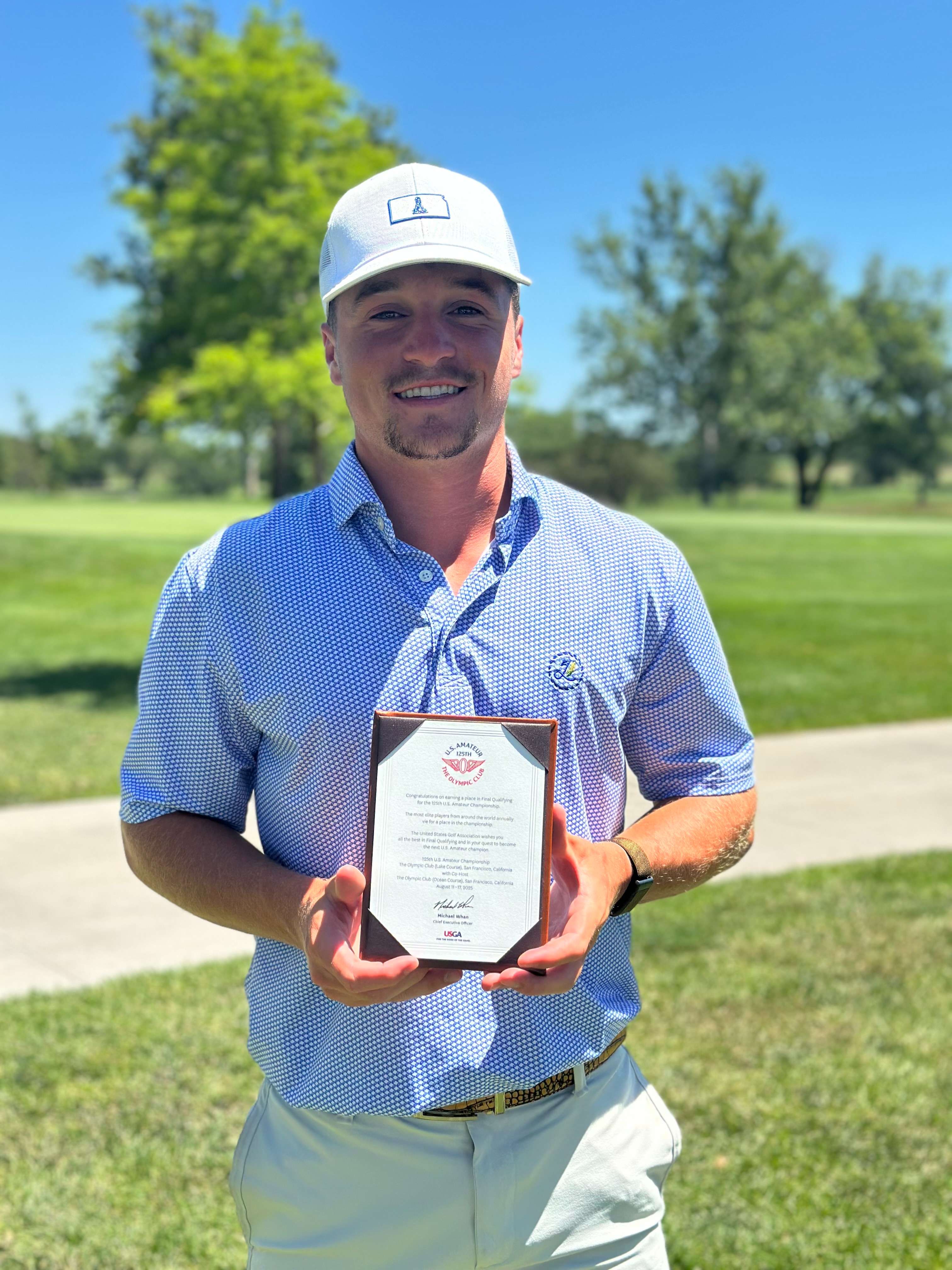 Ty Adkins poses with his qualifying certificate after shooting a 4-under-par 68 at Beatrice Country Club in Beatrice, Neb., on July 1, 2025, to advance to final qualifying for the 125th U.S. Amateur Championship.