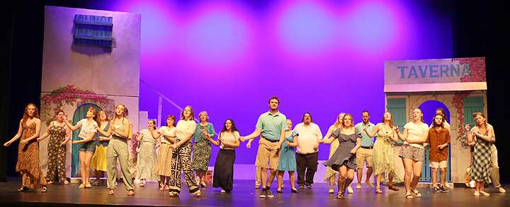 Cast members dance and sing to a reprise of Mamma Mia! at the conclusion of the Hays Community Theatre's performance of the musical "Mamma Mia!" Photo by Bill Gasper/Special to Post