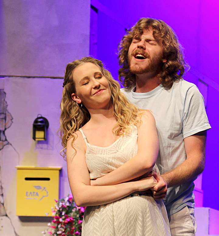On the eve of their wedding, Sophie (Rebecca Cole) and Sky (Nathan Stecklein) sing “Lay All Your Love On Me.” Photo by Bill Gasper/Special to Post