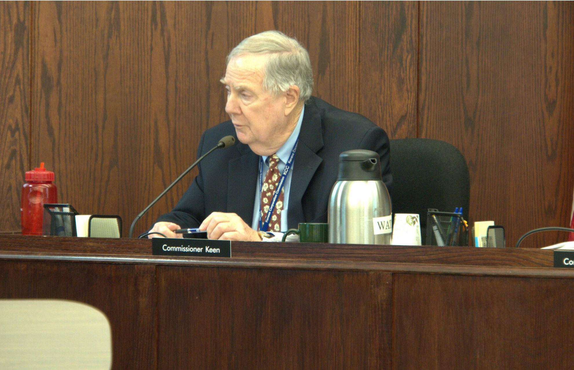 Kansas Corporation Commissioner Dwight Keen questioned Evergy officials about why they were willing to accept a settlement of about $69 million less than they originally requested. (Morgan Chilson/Kansas Reflector)