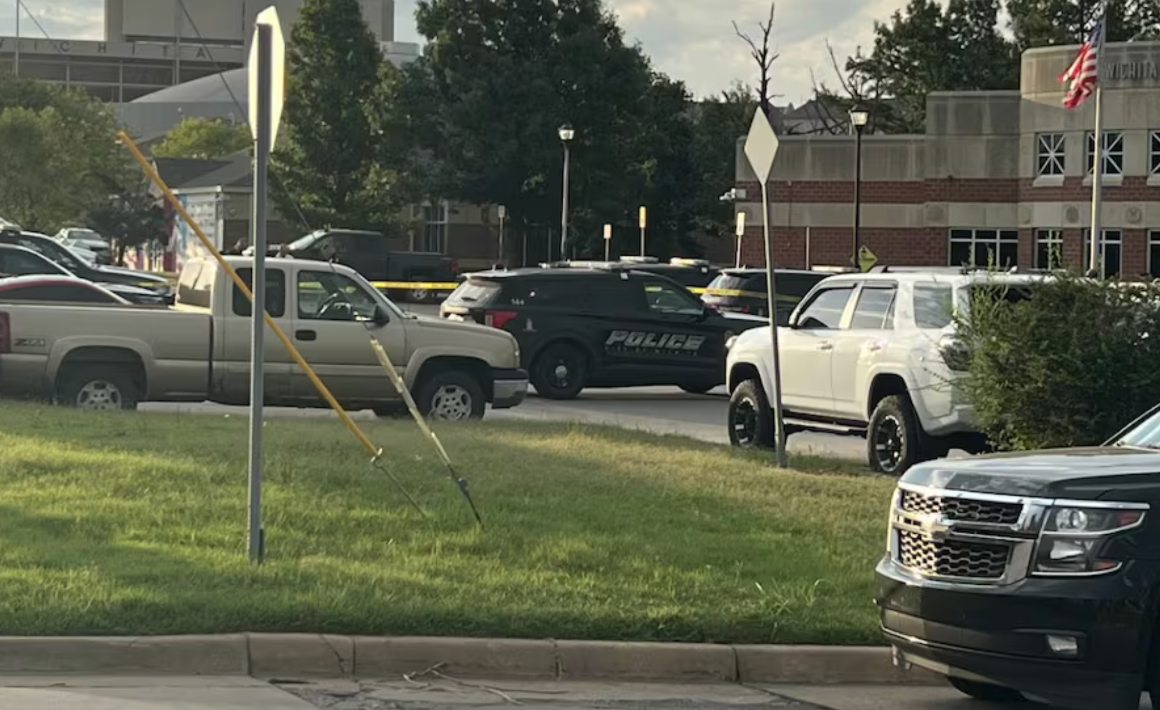 Investigators on the scene of the fatal officer-shooting-image courtesy KWCH