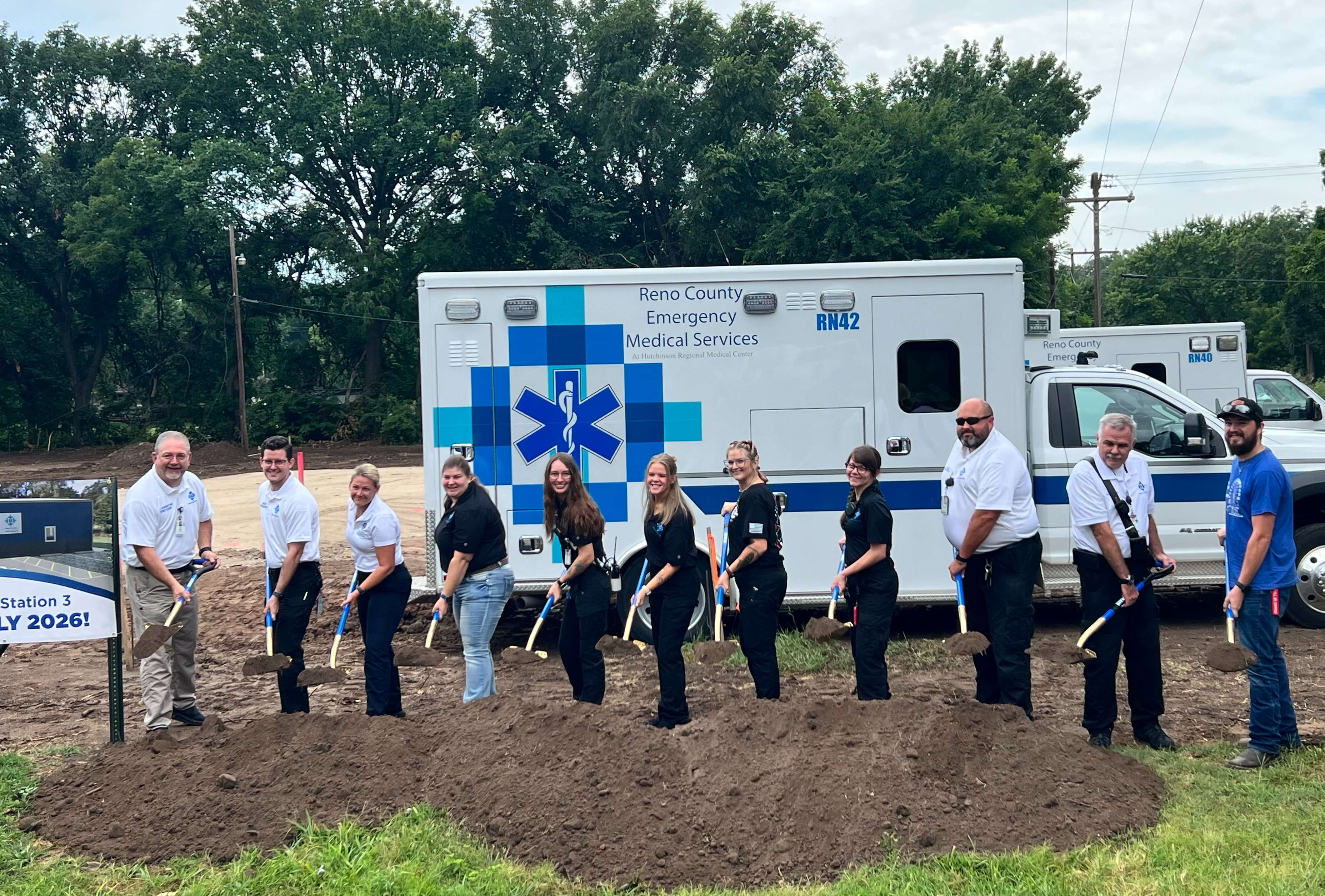 Members of the Reno County EMS team break ground Thursday, July 24, 2025, at the site of the new EMS Station 3, located at 107 W. Fair St. in Arlington. The new facility will replace the current downtown station and is expected to open in early 2026. (Hutch Post Photo/Sean Boston)