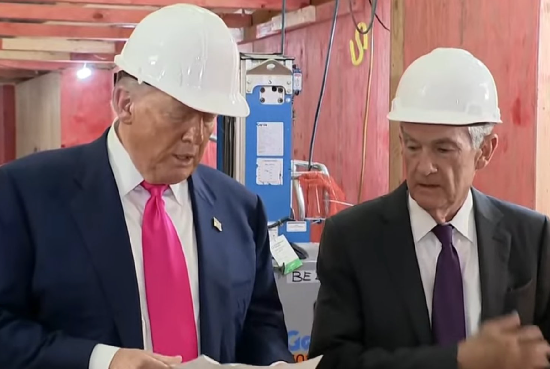 FILE - President Donald Trump and&nbsp;Federal Reserve Chairman Jerome Powell look over a document of cost figures during a visit to the Federal Reserve, Thursday, July 24, 2025, in Washington.-image from White House video