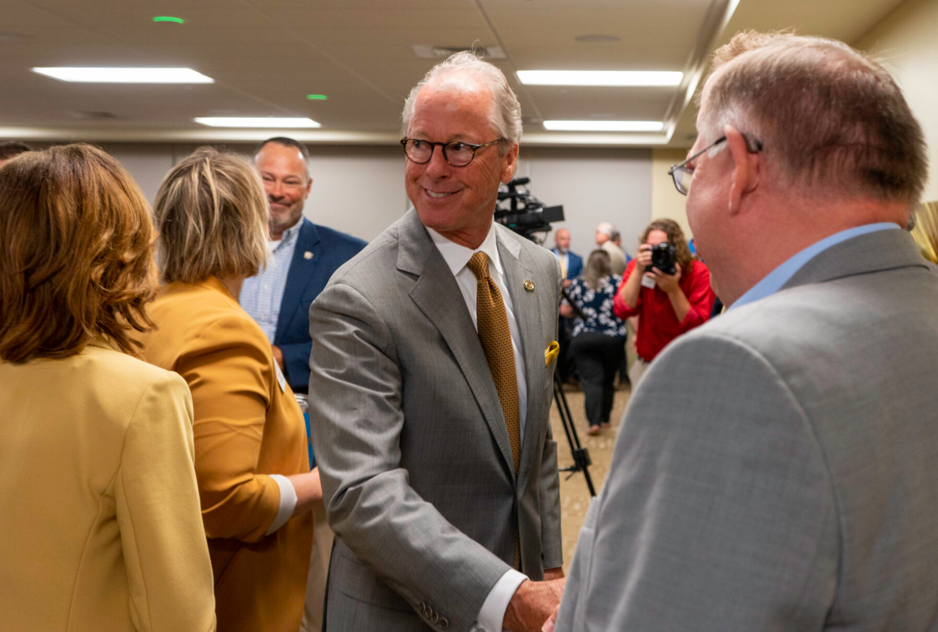 After the official announcement of Ken Hush being voted the next president of Emporia State University, Hush spent time talking with the faculty, staff, students and community members who attended the June 22, 2022, event. (Margaret Mellott/Kansas Reflector)