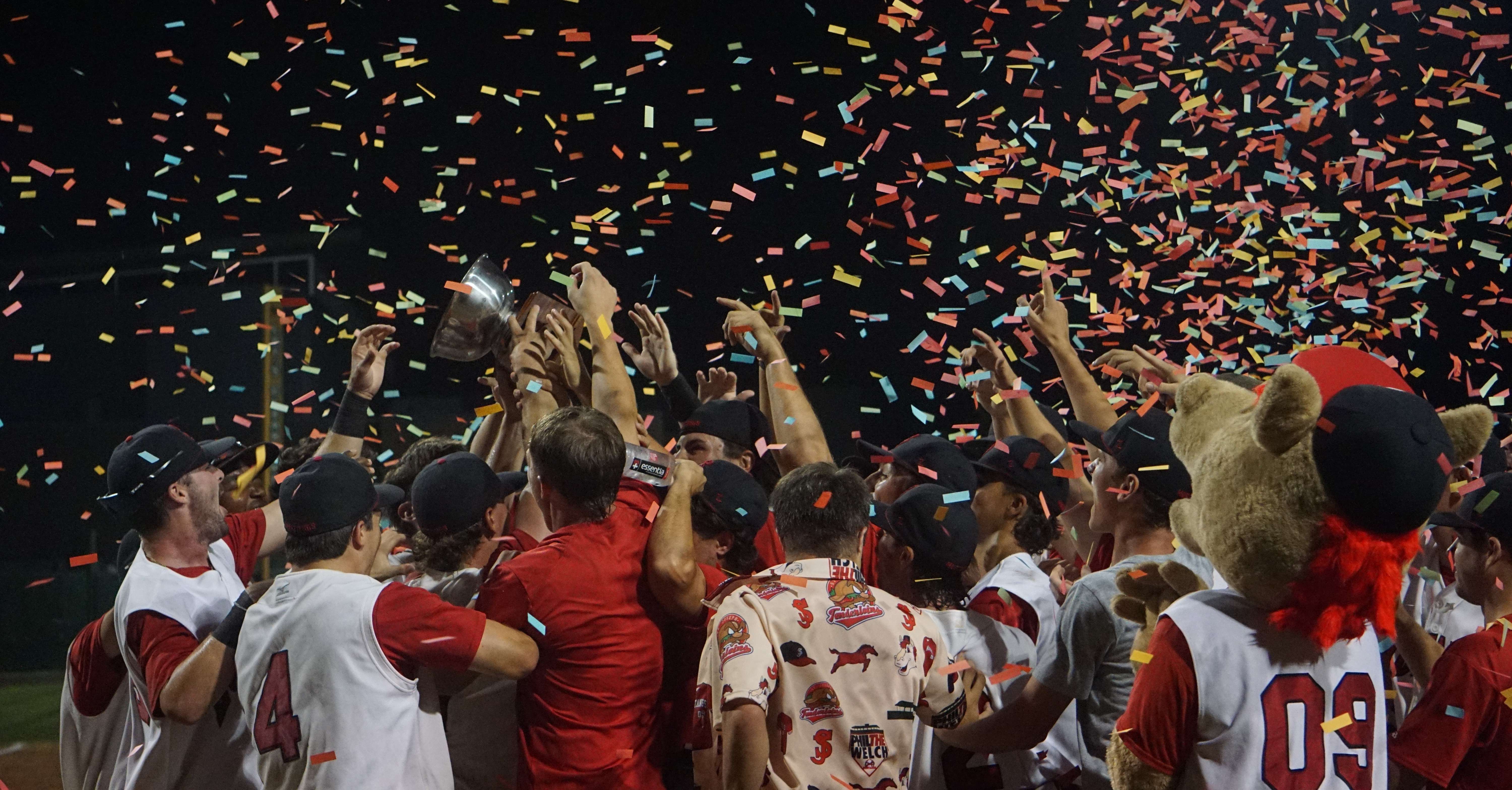 The St. Joseph Mustangs hoist the MINK League Championship trophy/ Photo by Matt Pike