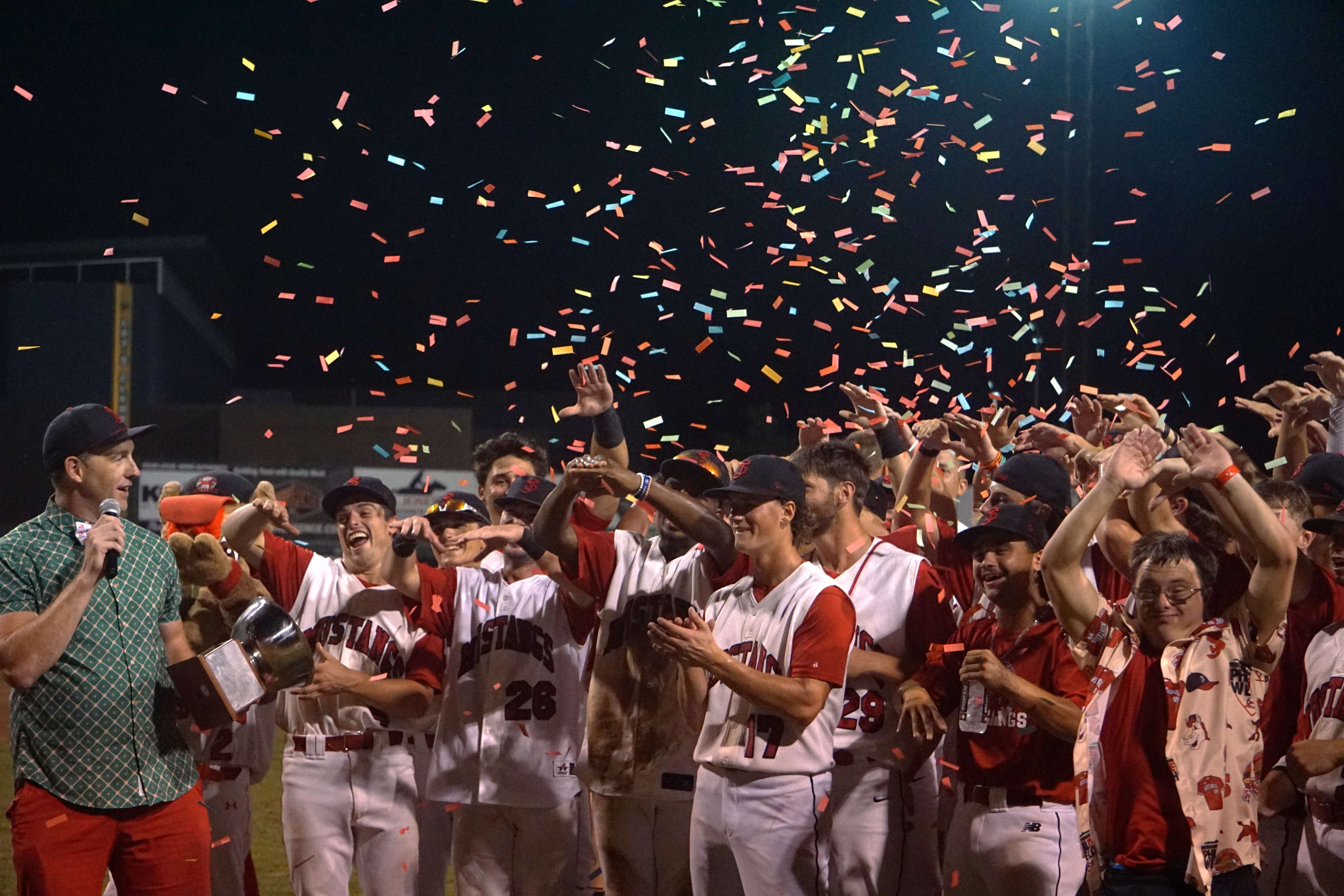 Mustangs General Manager and Owner and MINK League Commissioner Ky Turner presents the MINK League Championship trophy to the St. Joseph Mustangs/ Photo by Matt Pike.