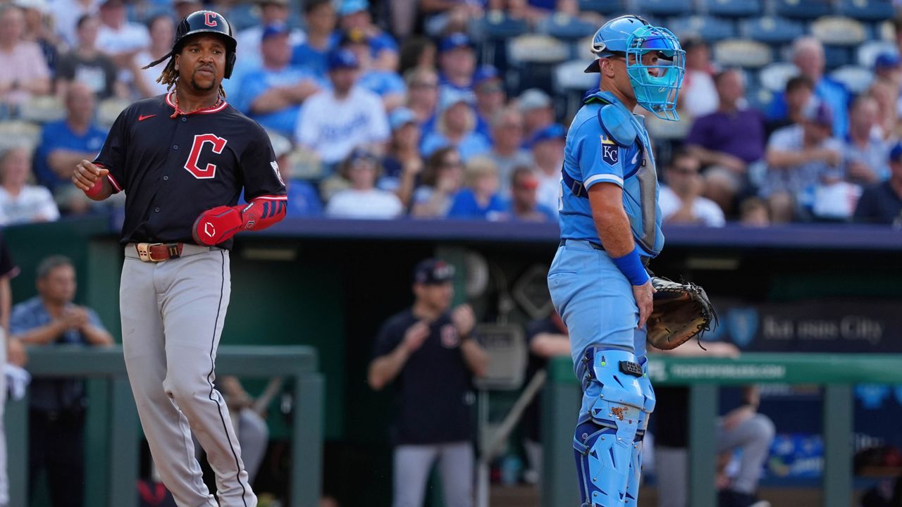 Cleveland Guardians' Jose Ramirez runs home to score past Kansas City Royals catcher Freddy Fermin on a two-run double hit by Johnathan Rodriguez during the first inning in the second baseball game of a doubleheader against the Kansas City Royals, Saturday, July 26, 2025, in Kansas City, Mo. (AP Photo/Charlie Riedel)