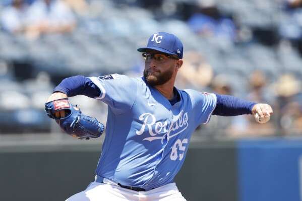 Kansas City Royals pitcher Noah Cameron delivers to a Cleveland Guardians batter during the first inning of a baseball game in Kansas City, Mo., Sunday, July 27, 2025. (AP Photo/Colin E. Braley)