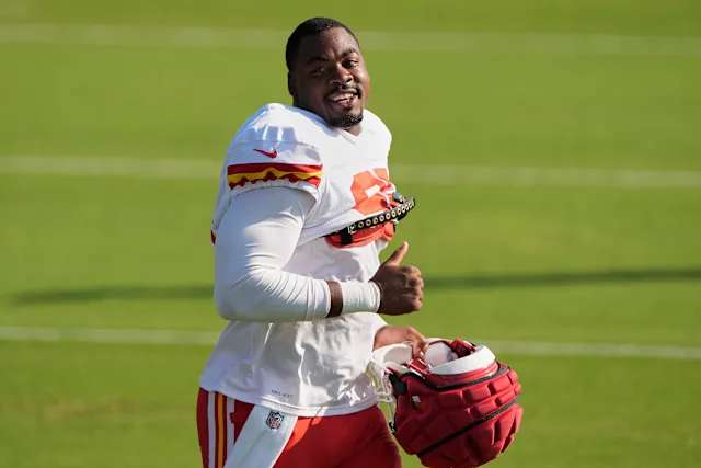 Kansas City Chiefs defensive tackle Chris Jones acknowledges fans as he jogs between drills during Back Together Weekend at the team's NFL football training camp, Sunday, July 27, 2025, in St. Joseph, Mo. (AP Photo/Charlie Riedel)