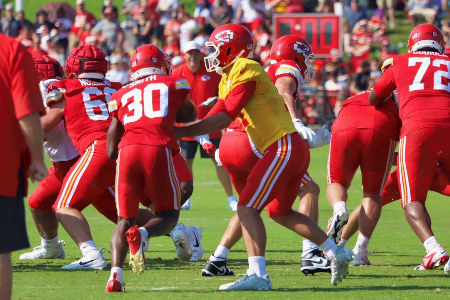 Bailey Zappe hands the ball off to Brashard Smith/ Photo by Alexis Starks
