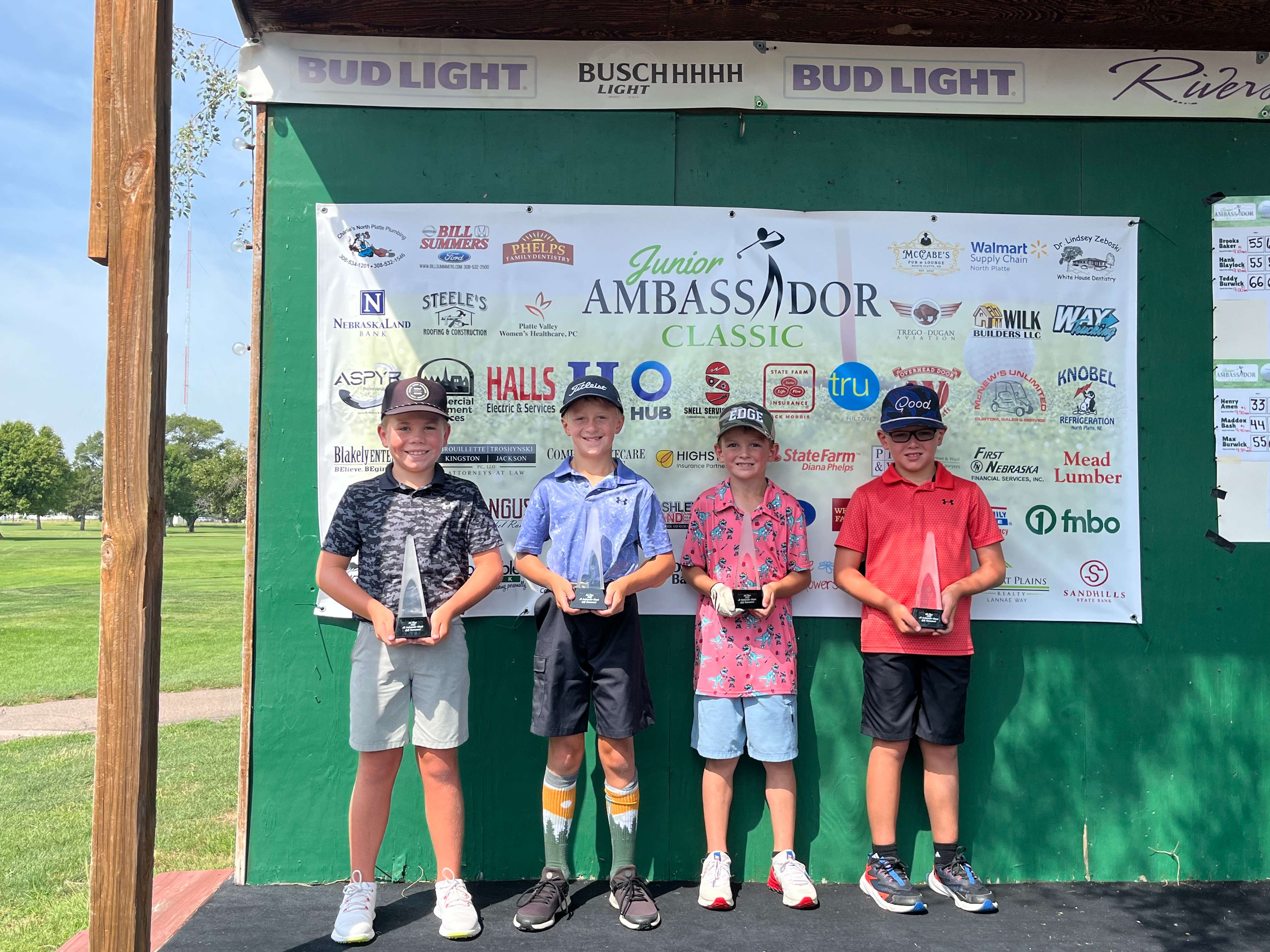 Winners of the Boys 7-9 flight stand on the stage Tuesday following the final day of play at the 2025 Junior Ambassador Classic in North Platte. Pictured left to right are: Cooper Rippen, McCook, (first place); Carter Schwartz, Kearney, (second); Cooper Peers, Mullen, (third) and Aric Sharp, McCook, (fourth)