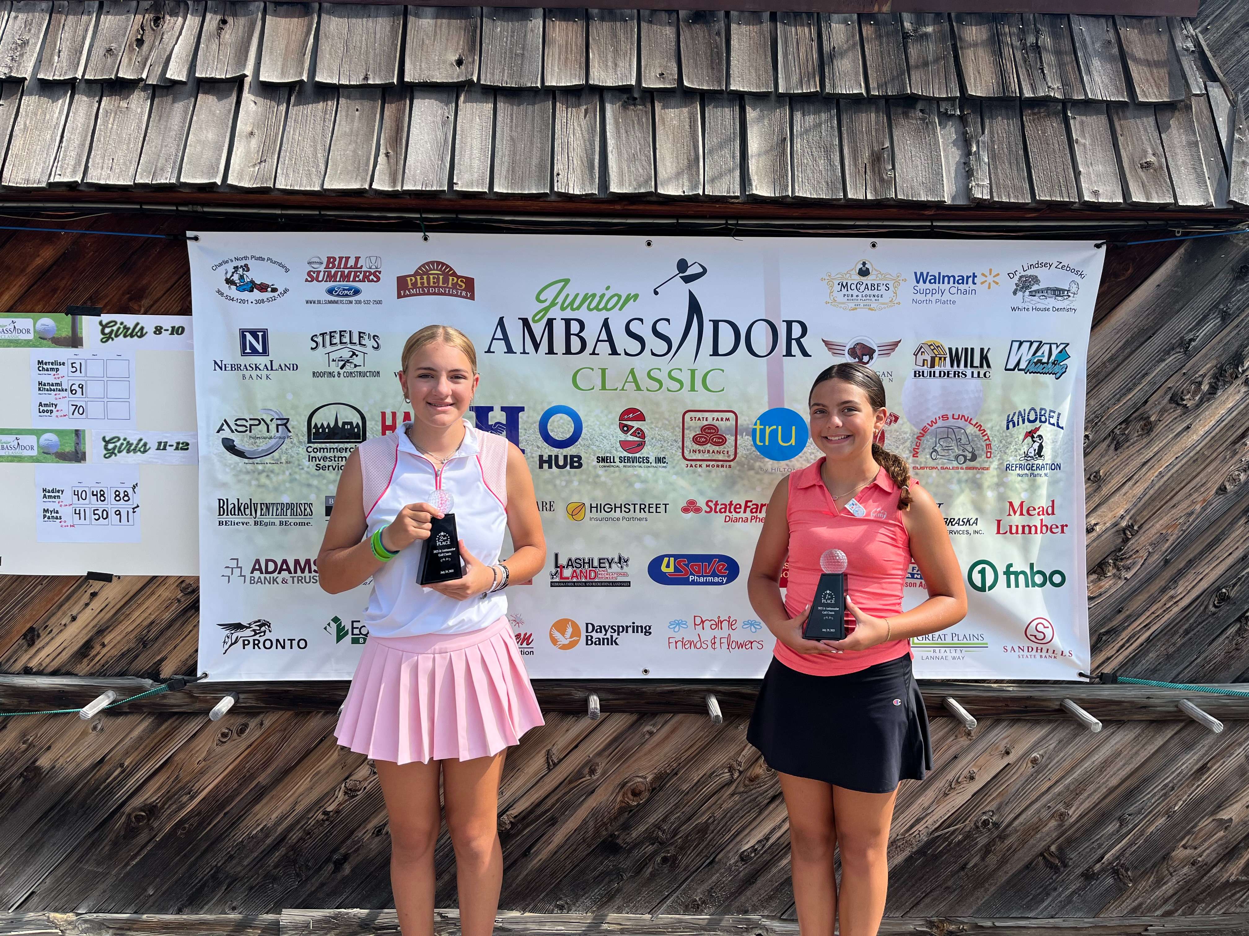 Winners of the Girls 11-12 flight stand on the stage Tuesday following the final day of play at the 2025 Junior Ambassador Classic in North Platte. Pictured left to right are: Hadley Amen, Imperial, (first) and Myla Panas, Bridgeport, (second).