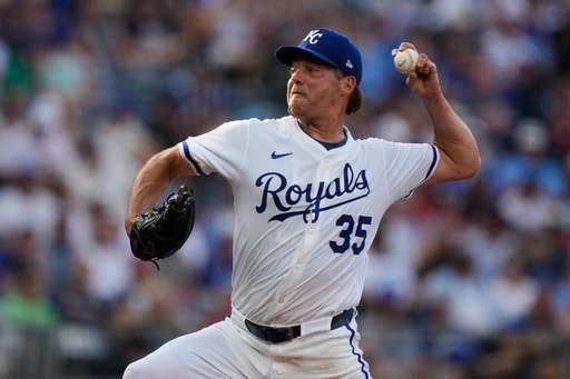 Kansas City Royals starting pitcher Rich Hill throws during the first inning of a baseball game against the Atlanta Braves, Monday, July 28, 2025, in Kansas City, Mo. (AP Photo/Charlie Riedel)