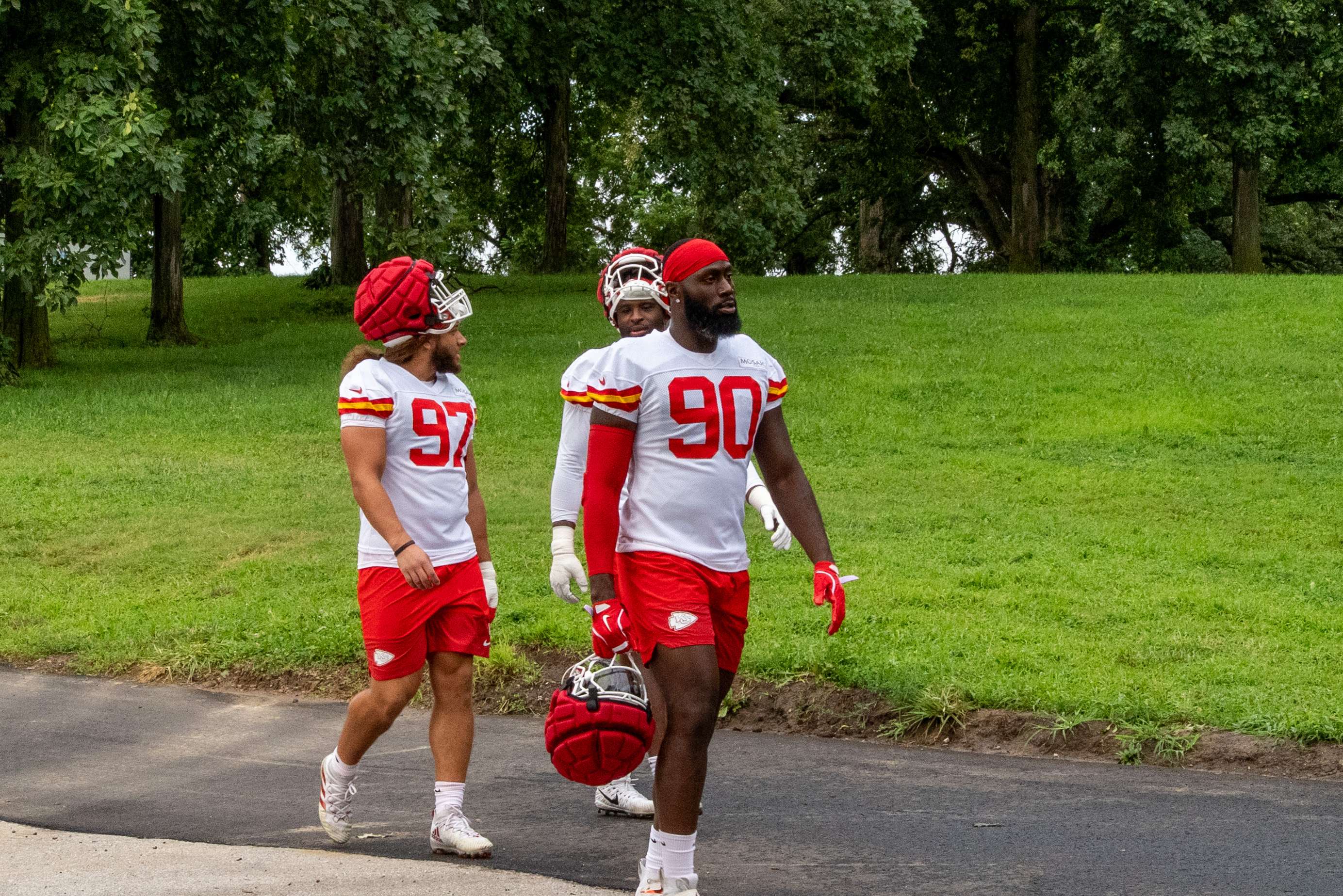 Charles Omenihu (90) walks down the hill with rookie Ashton Gillotte (97) for practice on Wednesday/ Photo by Justin Peacock