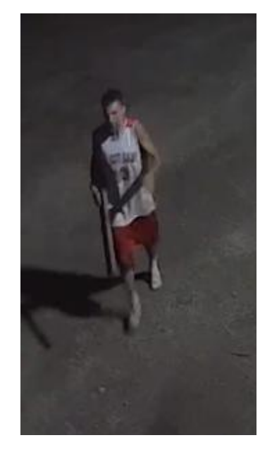 Surveillance footage of suspect who allegedly damaged several buildings and vehicles in the area of Barney St. on Sunday, July 6th; screenshot provided by the Salina Police Department