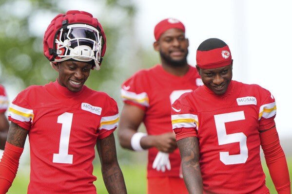 Kansas City Chiefs wide receivers Xavier Worthy (1) and Hollywood Brown (5) arrive at NFL football training camp Tuesday, July 22, 2025, in St. Joseph, Mo. (AP Photo/Charlie Riedel)