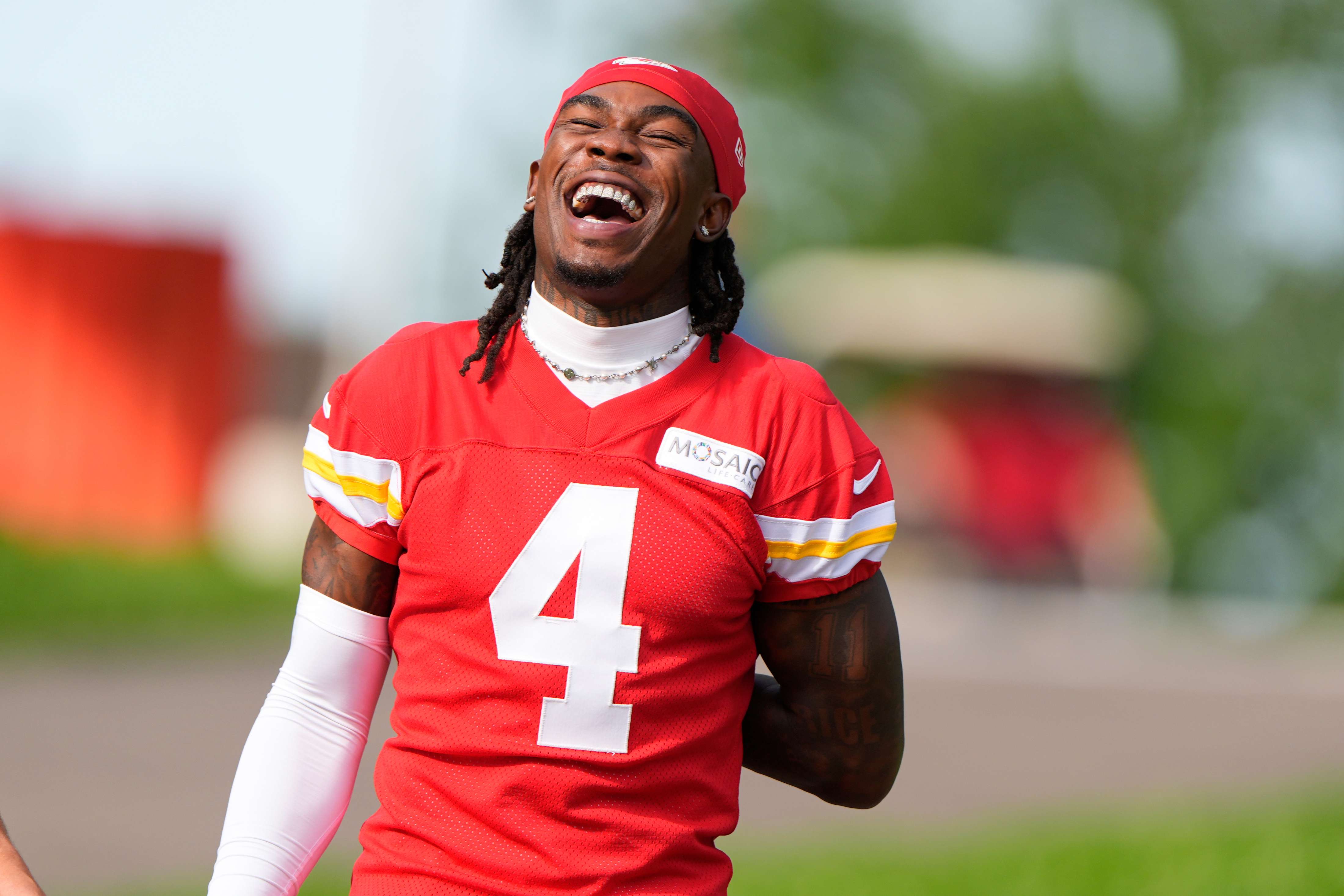 Kansas City Chiefs wide receiver Rashee Rice laughs with a teammate as he arrives at NFL football training camp Tuesday, July 22, 2025, in St. Joseph, Mo. (AP PhotoCharlie Riedel)